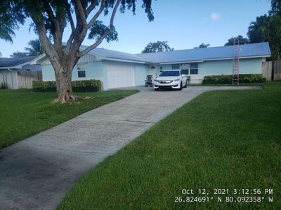 Residential Roofing Installation using 1" Nail strip metal roof