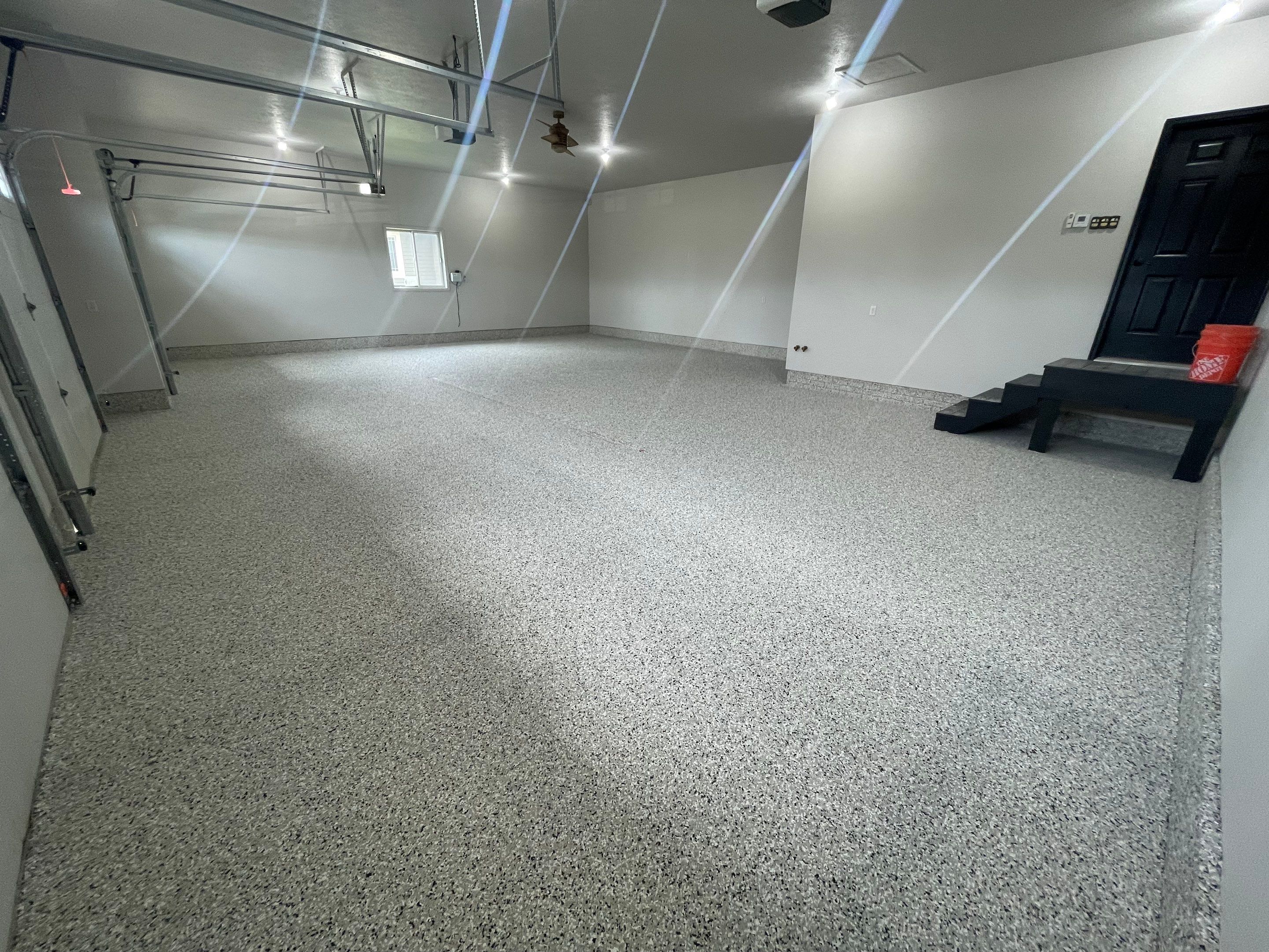 Multi-Car Garage Epoxy Floor Coating in Beresford by Select Painting, Coatings & Garage Cabinets