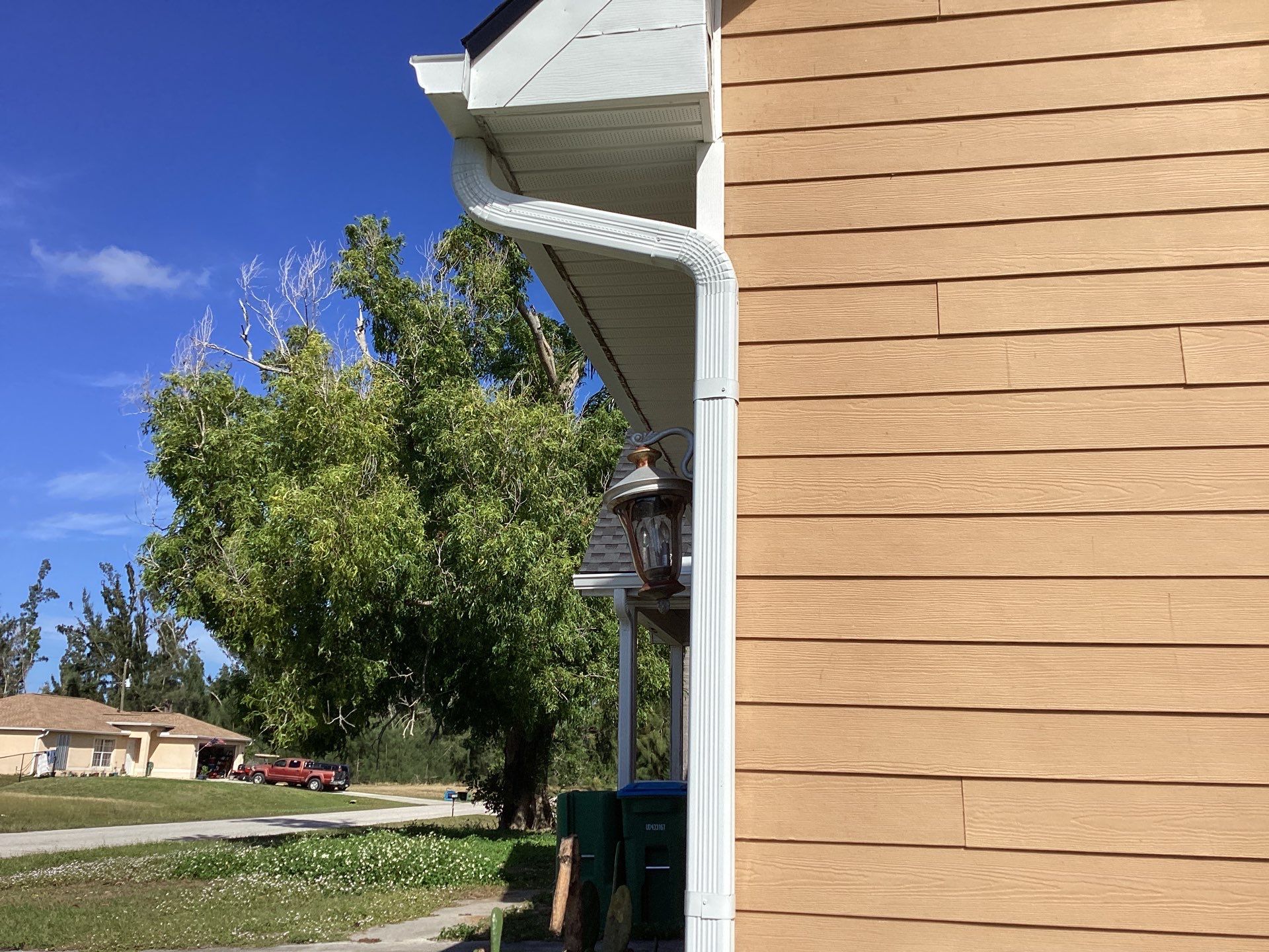 Soffit & Fascia White + New Downspouts by Gutter Professors