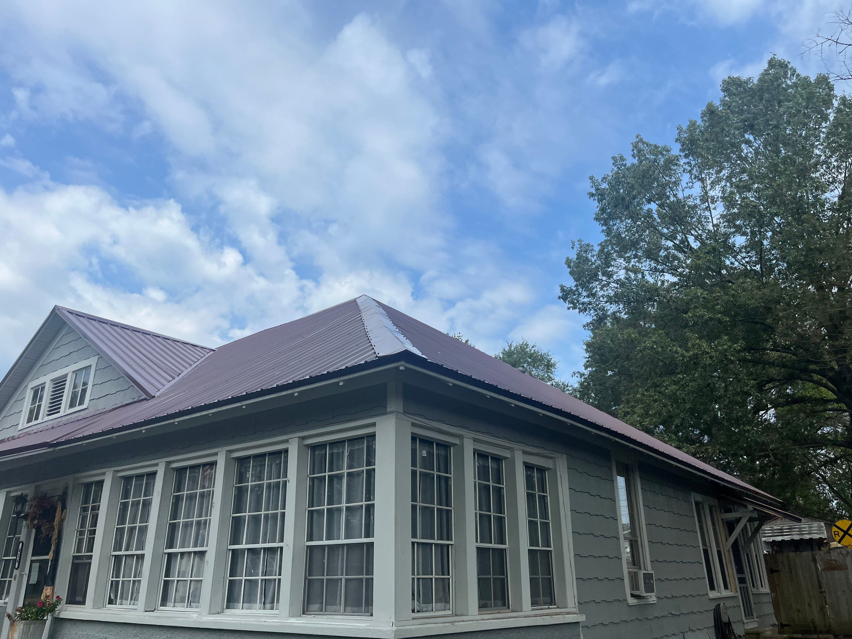Residential Metal Roof Replacement using Reed's Metals: Colored Residental Panel (Burgundy) by Hostetler Roofing