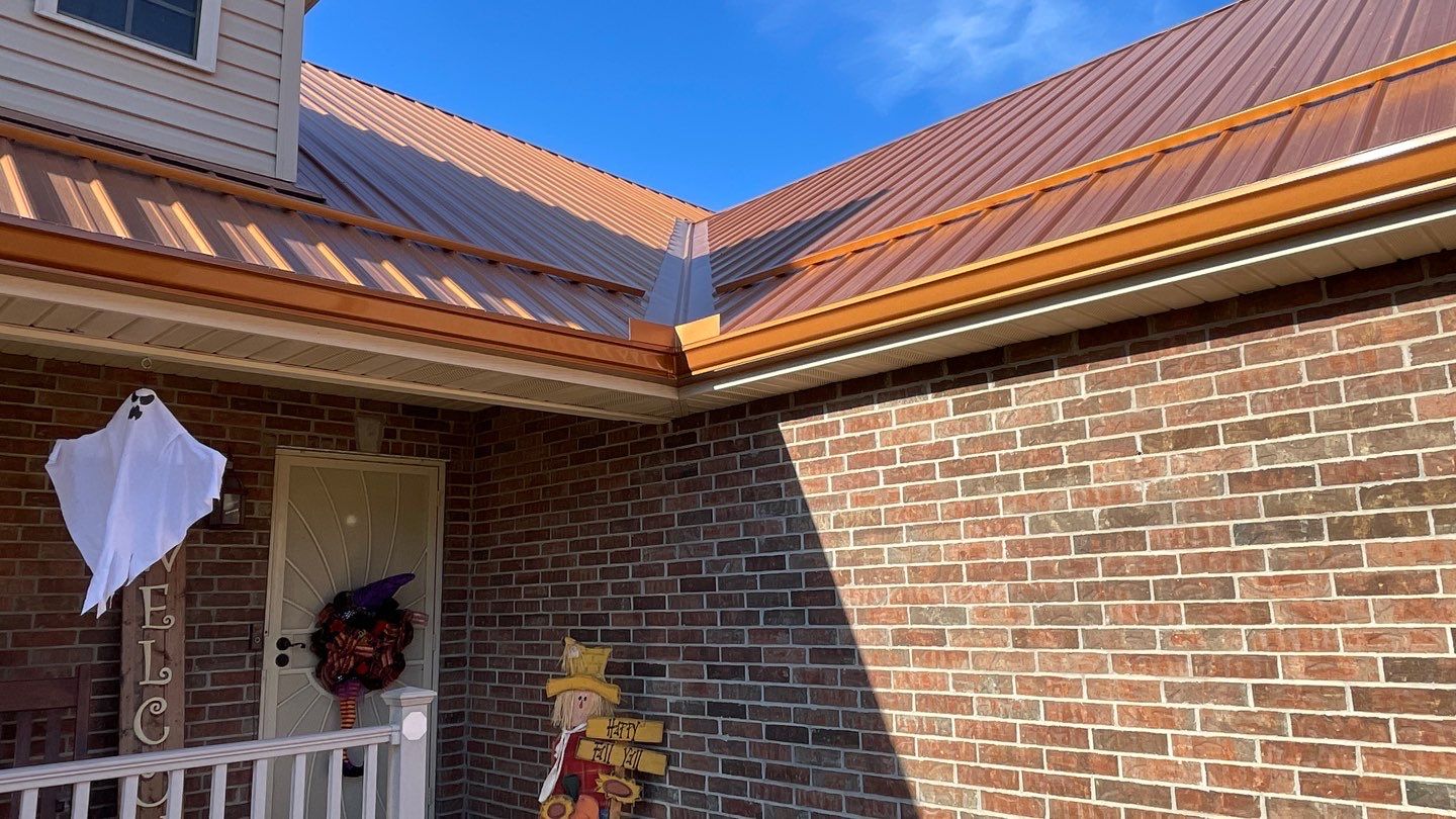 Residential Roofing Install - Copper 29 Guage G-Rib Metal & 6" Inch Seamless Gutters + 3"x4" Aluminum Downspouts  by Titan Commercial & Residential Roofing 