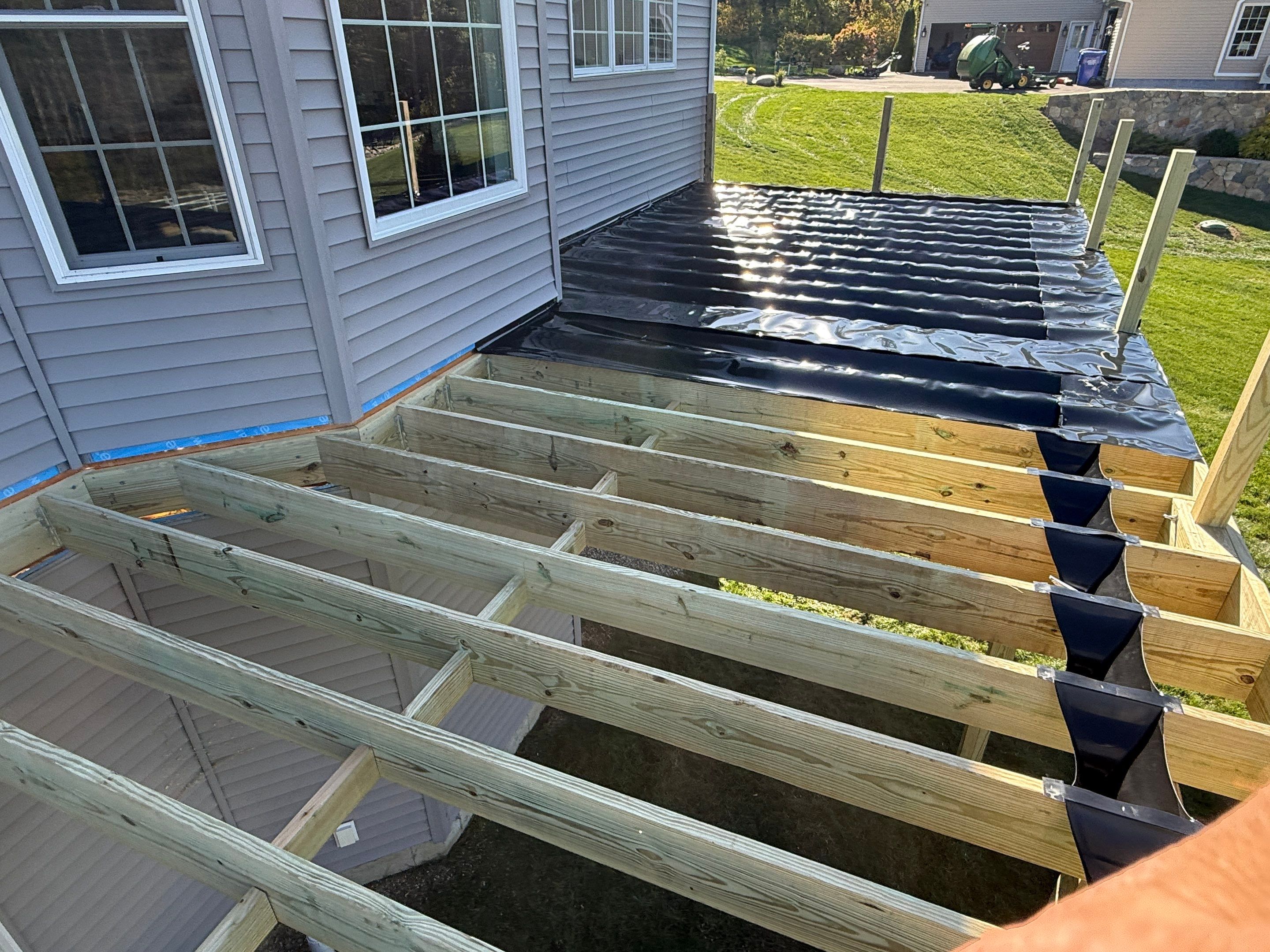 Deck replacement and expansion, With useable under space. Trex Tropical Island mist boards.  by DiGiorgi Roofing and Siding Inc