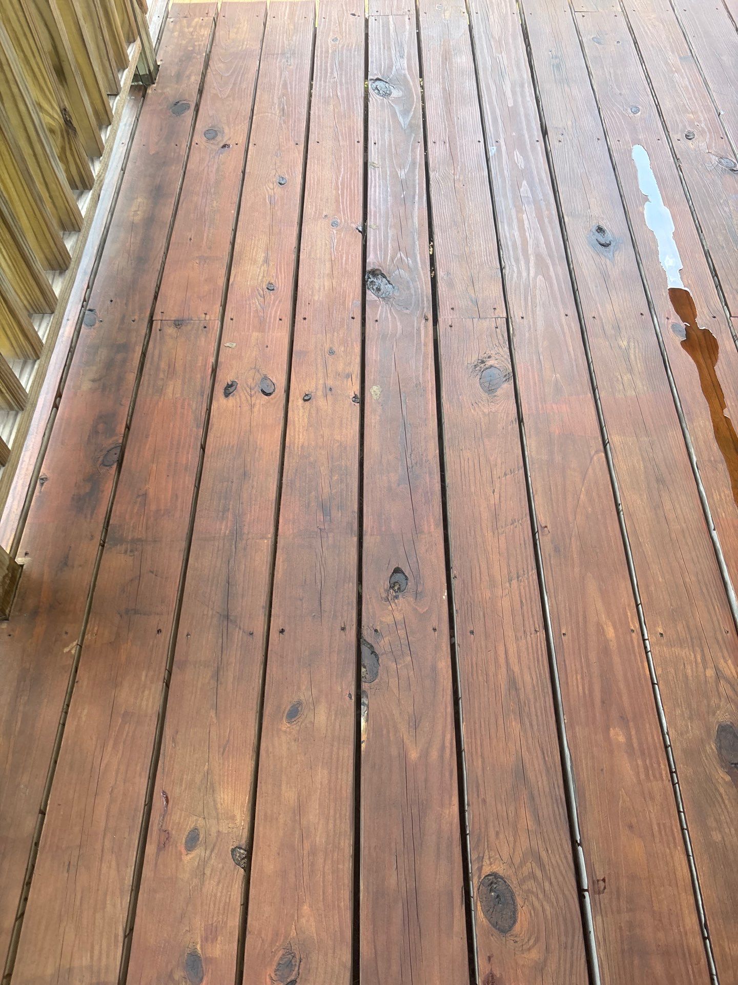 Exterior Painting in Fruitvale, TX | Wood Porch & Home in Deep Navy Blue by Quality Coats Painting