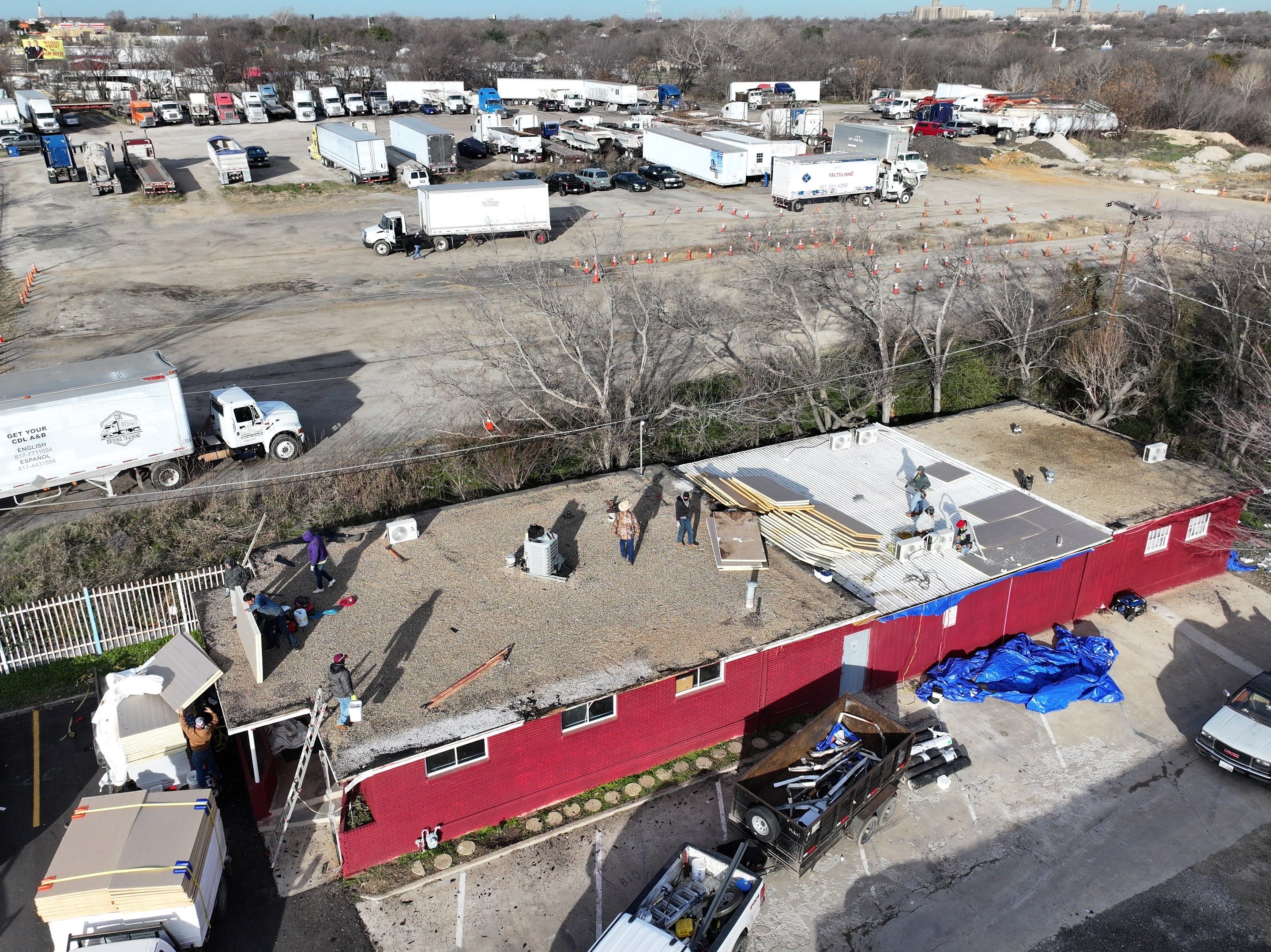 Commercial roofing overlay using GAF TPO over an old ballast roof by Becker Roofing and Exteriors