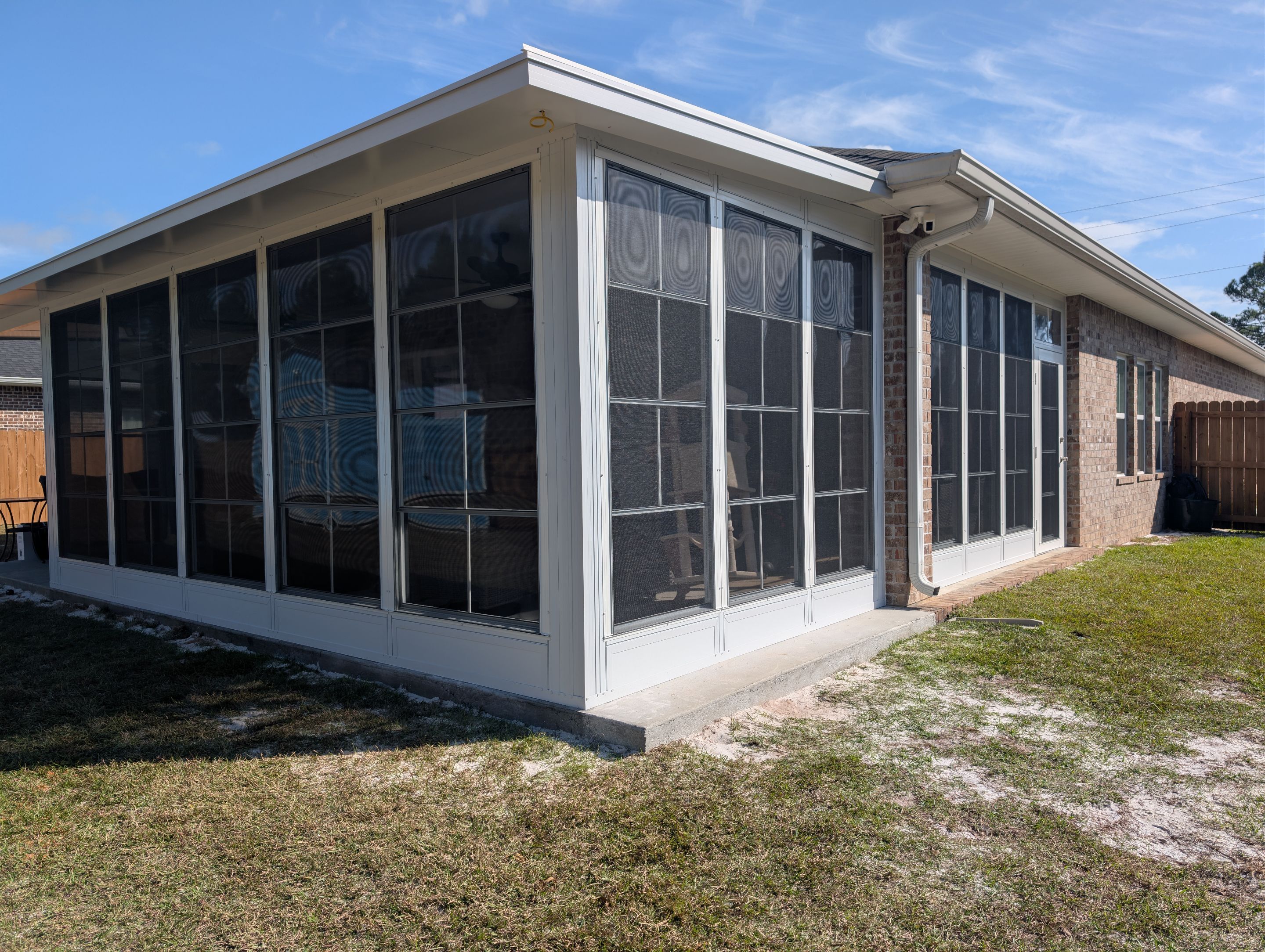 Home addition w/Vinyl 4-Track Windows by Titan Sunrooms