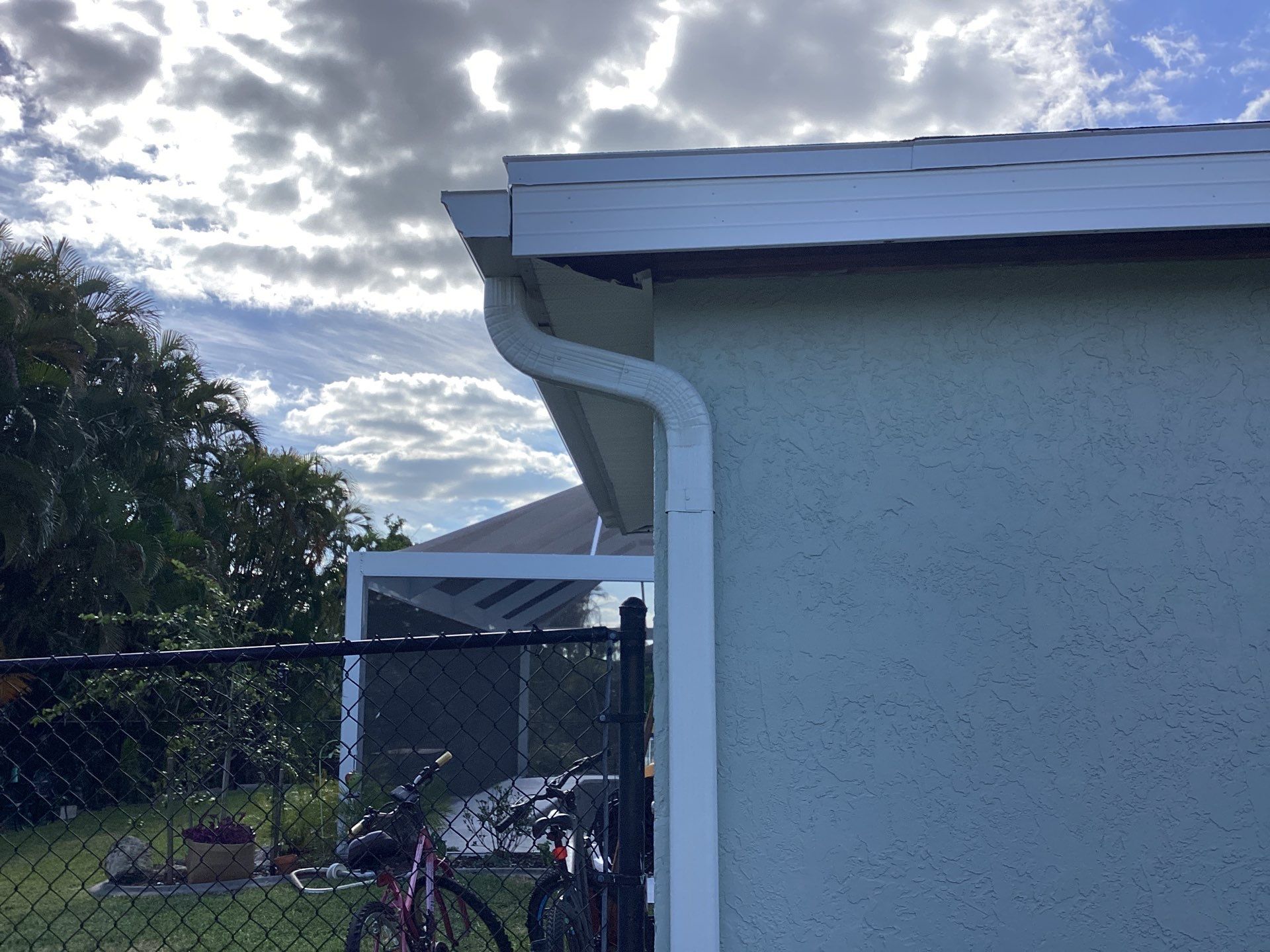 Downspout Installation using 3X4 Elbow Downspout in Cape Coral FL by Gutter Professors