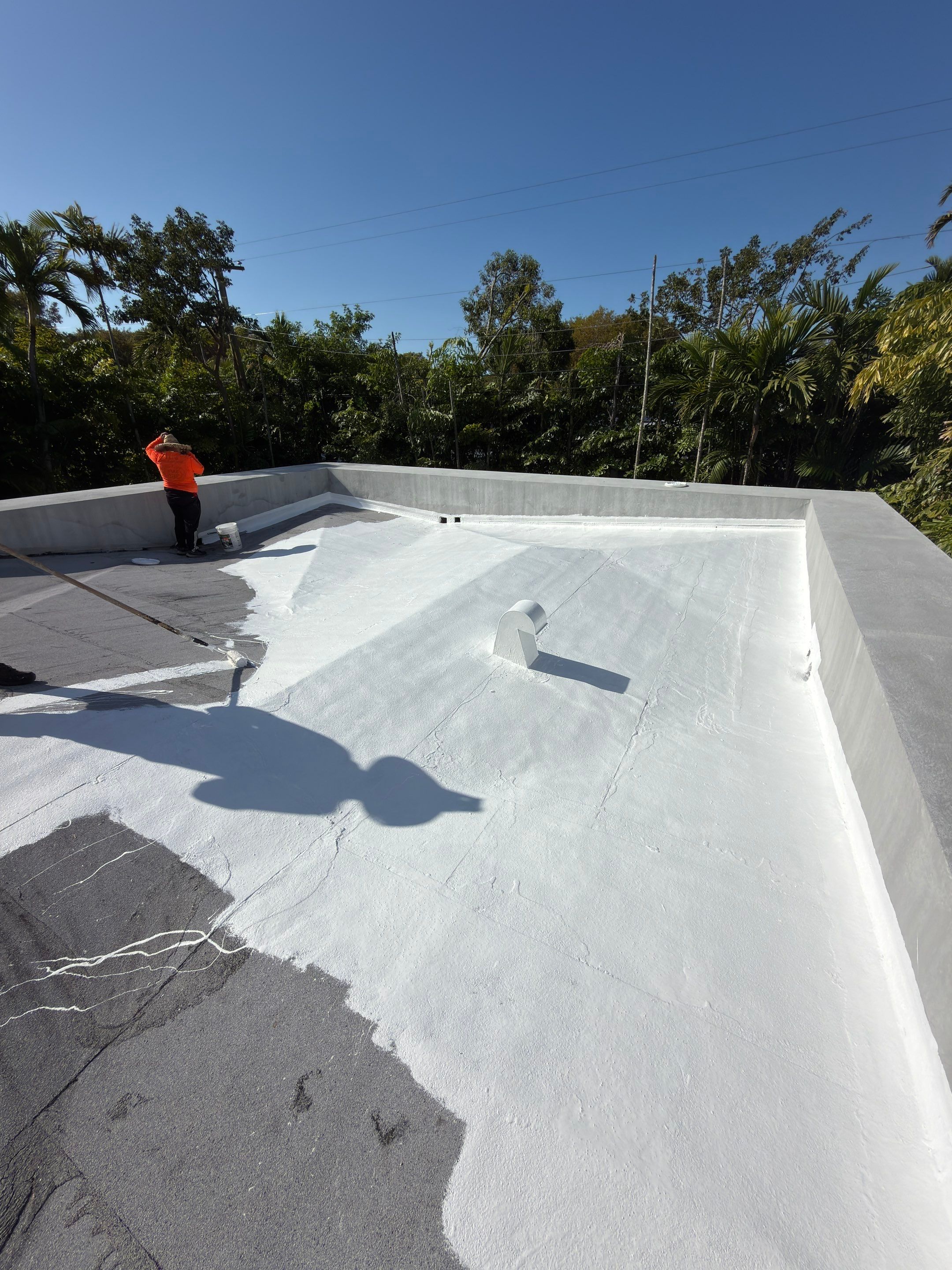 Flat Roof Silicone Coating and Interior Water Damage Restoration in Miami by Picos Construction Engineering