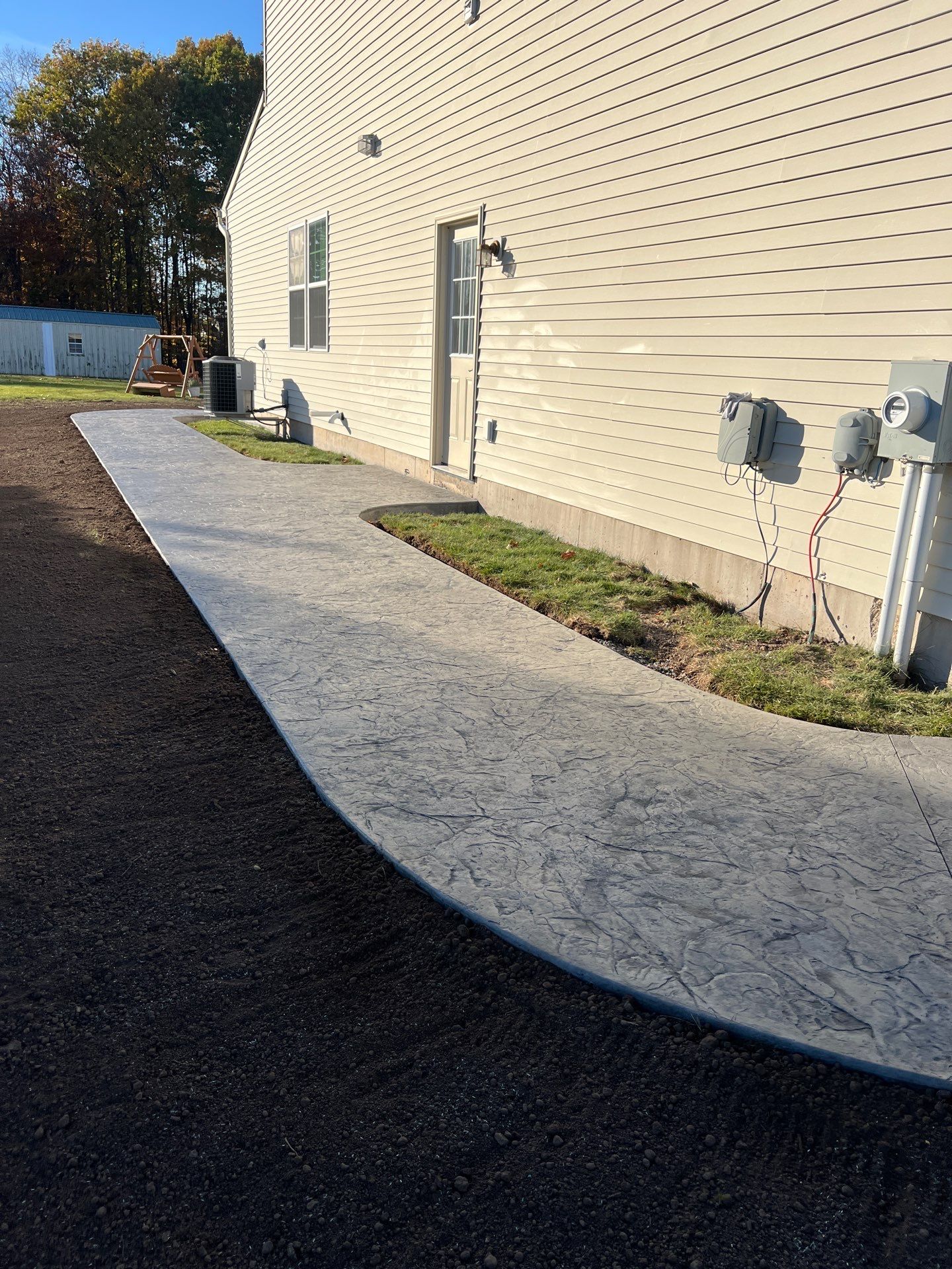 Oxford Slate stamped concrete patio  by NG Masonry & Construction LLC