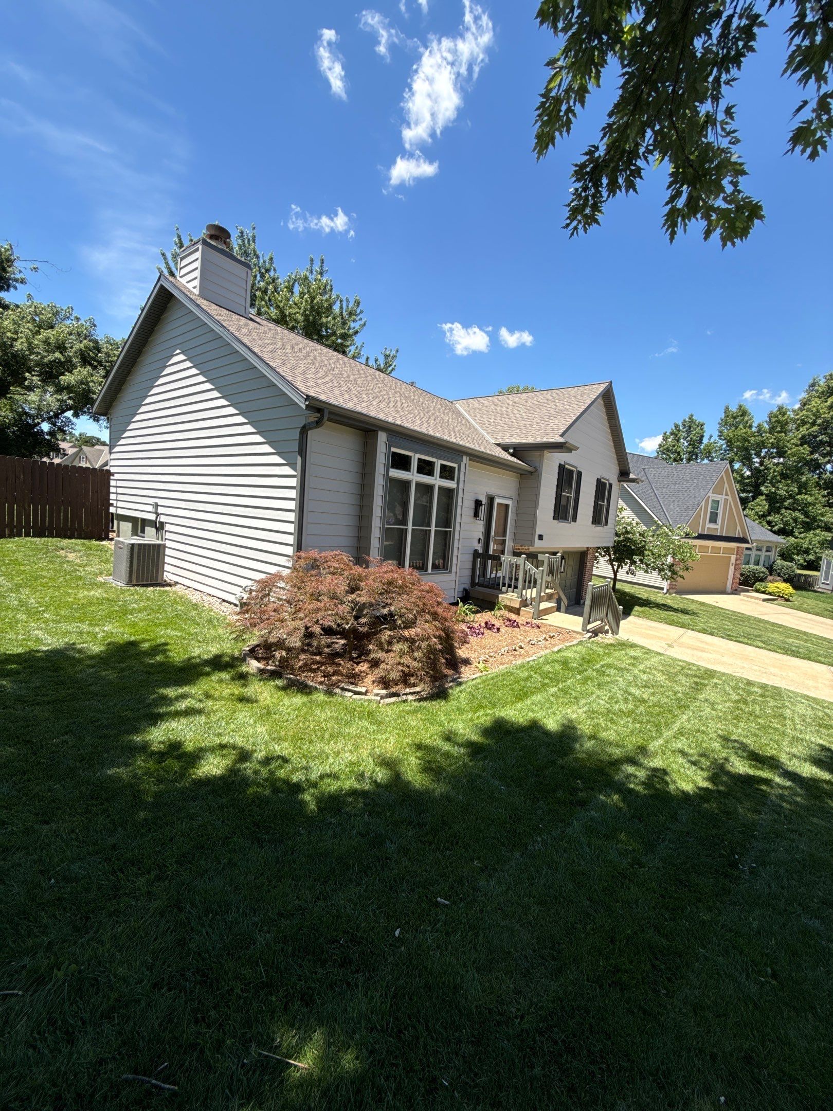 Whole-Home Craneboard Siding Replacement and Exterior Renovation in Shawnee by EEC Windows, Siding & Roofing