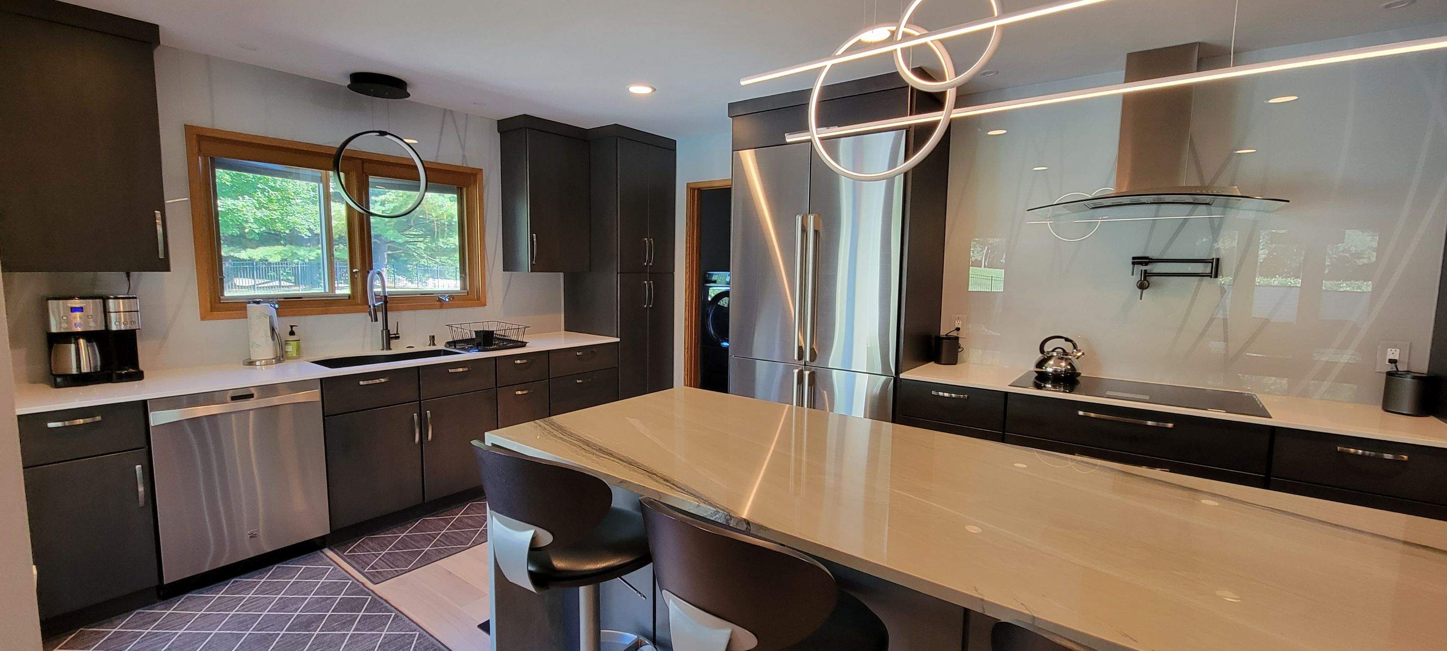 Kitchen Remodel using IMAGIO Misty Curves Solid Glass Backsplash by IMAGIO