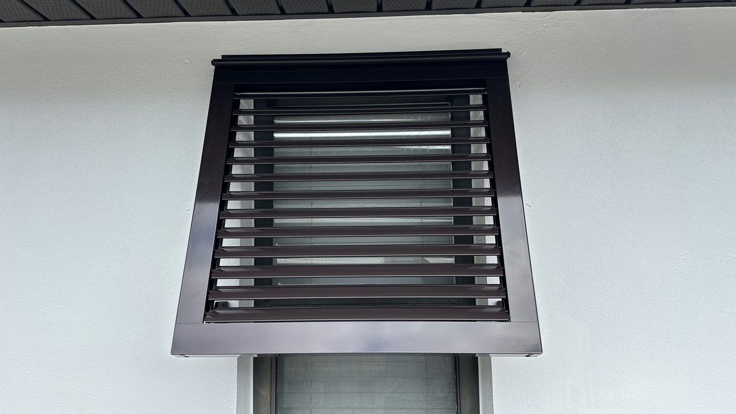 Bahama Shutters in Grey Brown by Smart Guard Shutters