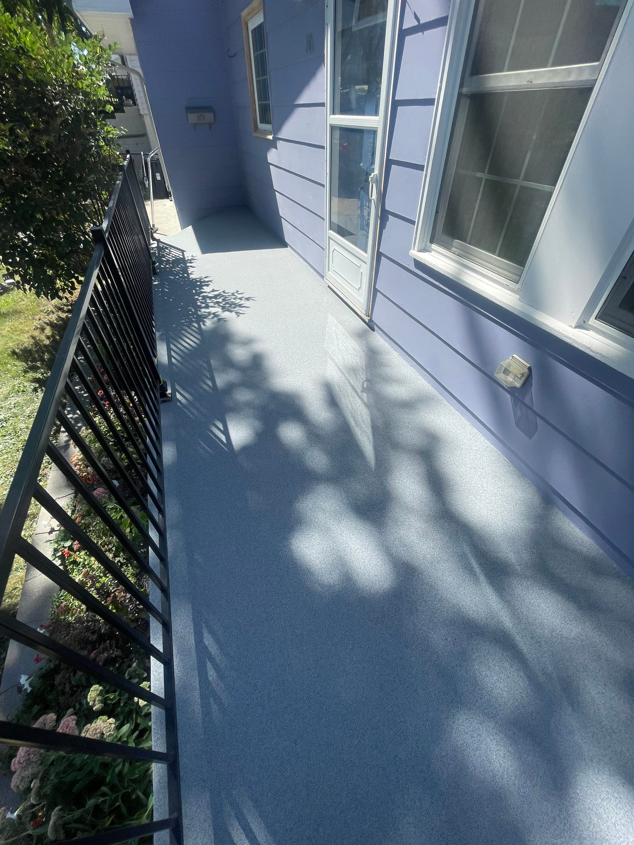 Sioux Falls Concrete Porch Coating with Starry Evening Finish by Select Painting, Coatings & Garage Cabinets
