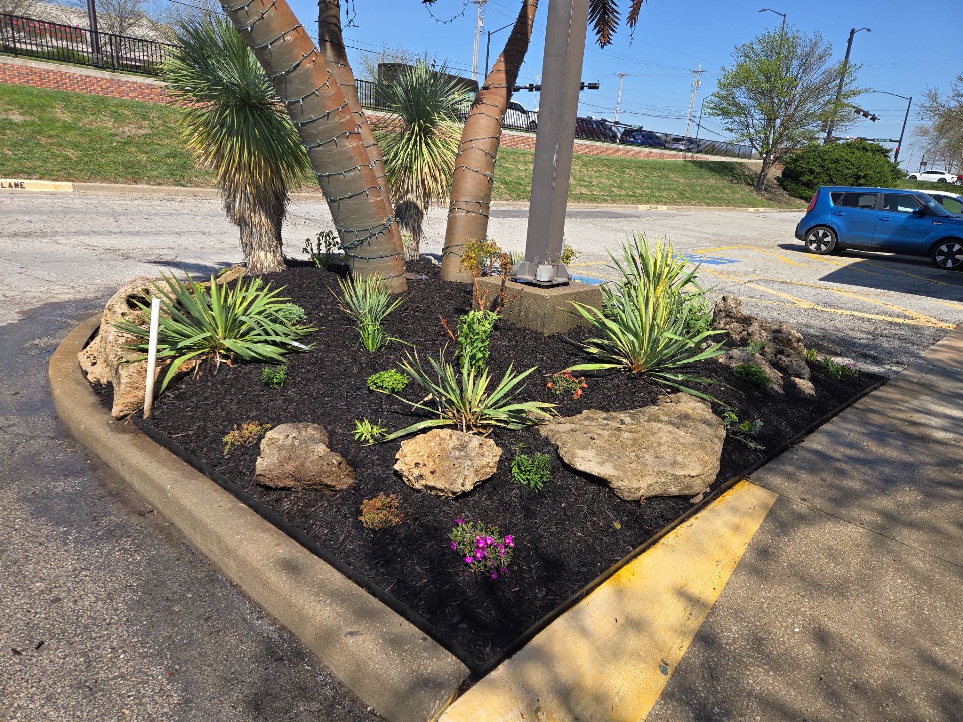 Restuarant Landscape Installation and Parking Lot Islands in Lenexa by LAND ESCAPES LLC