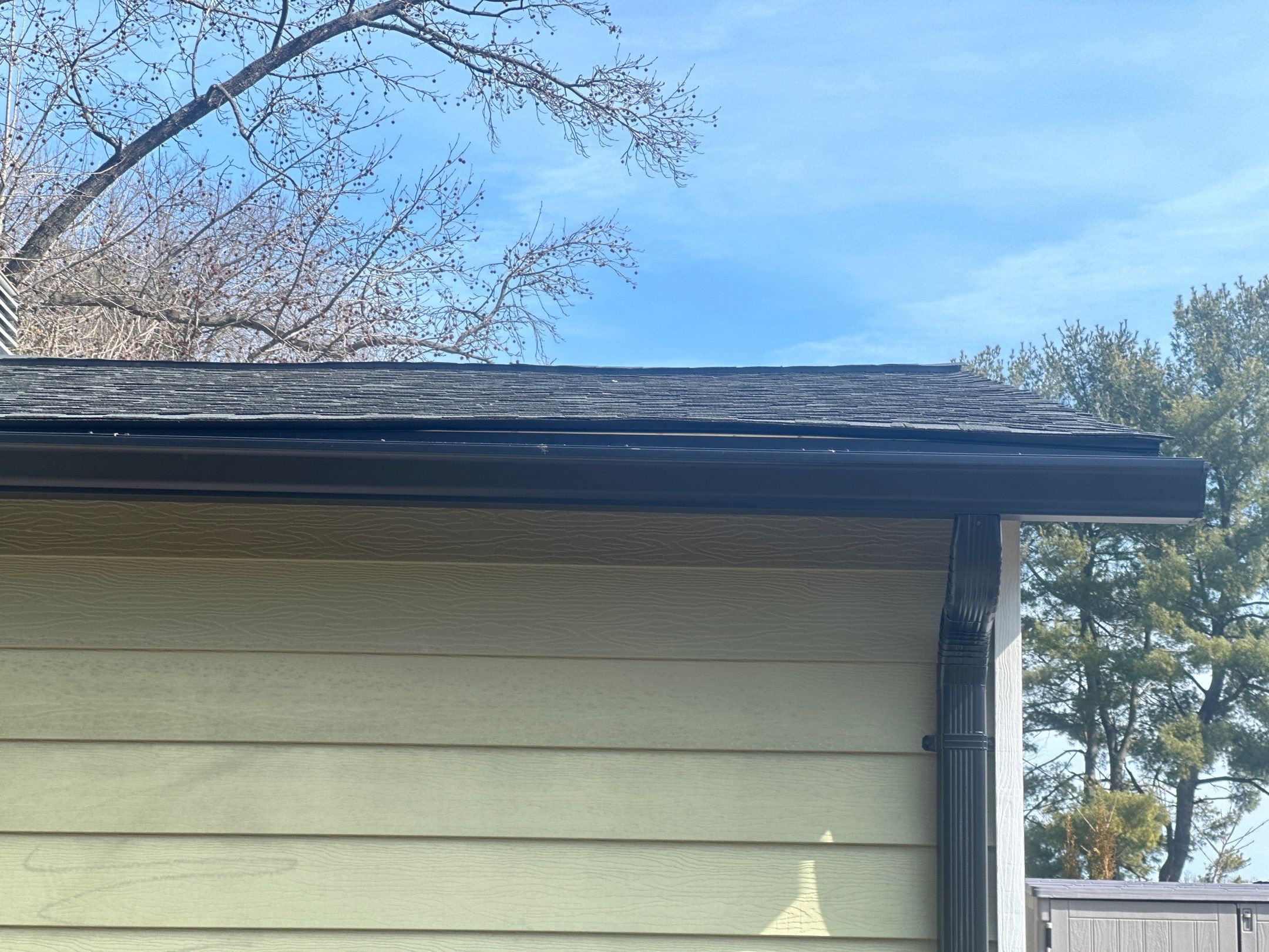 Blacked Out Gutters / Gutter Guards by American Home Contractors