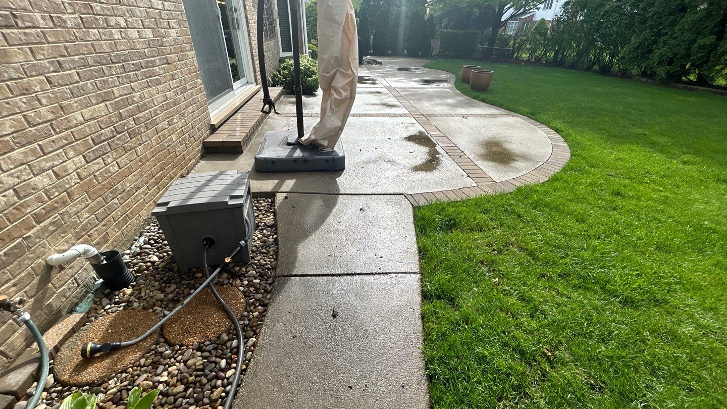 concrete patio and driveway cleaning by Northern Power Washing LLC.