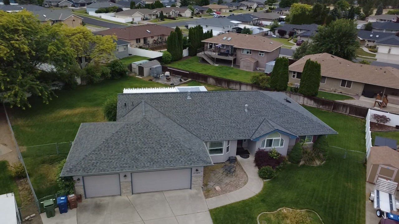Spokane Residential Roof Replacement With Solar Panel and Skylight Integration N Portsmouth Ct Spokane, WA 99208  The Denali System - Certainteed Landmark® Shingle - Granite Gray by Alpine Roofing