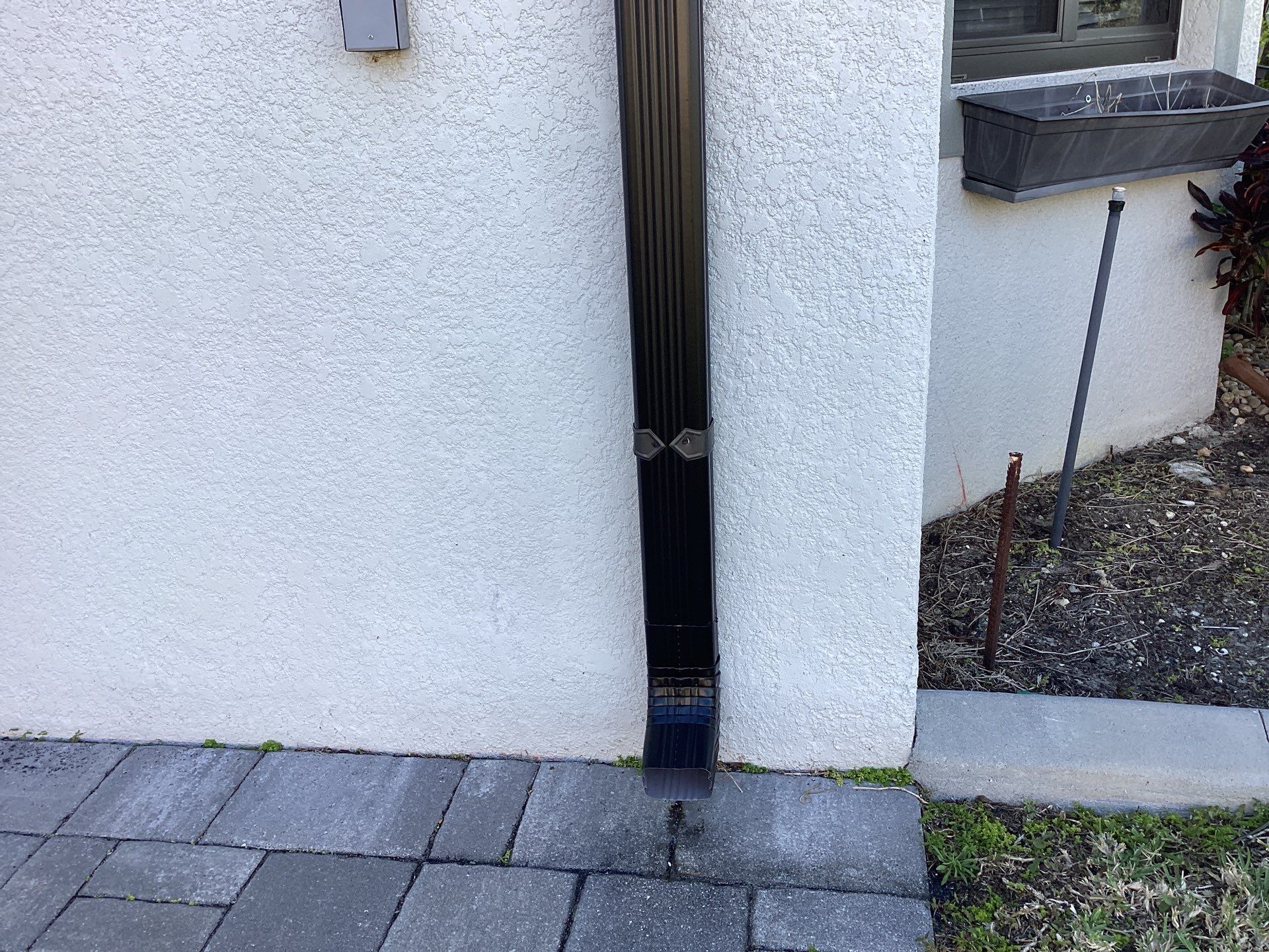 Black Seamless Gutters using 6 Inch Seamless Gutters in Cape Coral FL by Gutter Professors