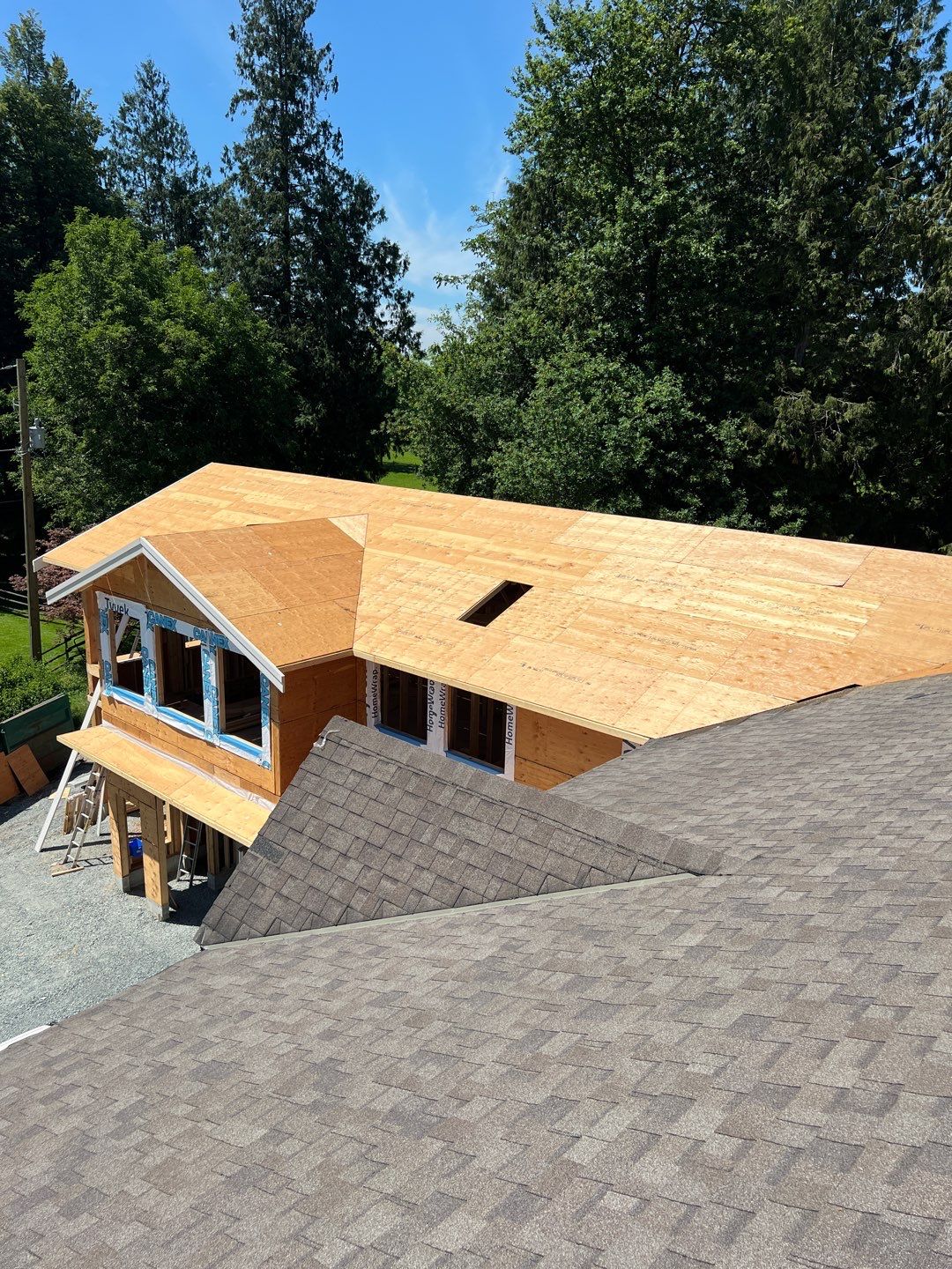 Residential Roofing Installation using OC Oakridge shingles and Duraclad Accent roof by Top Notch Roofing Inc