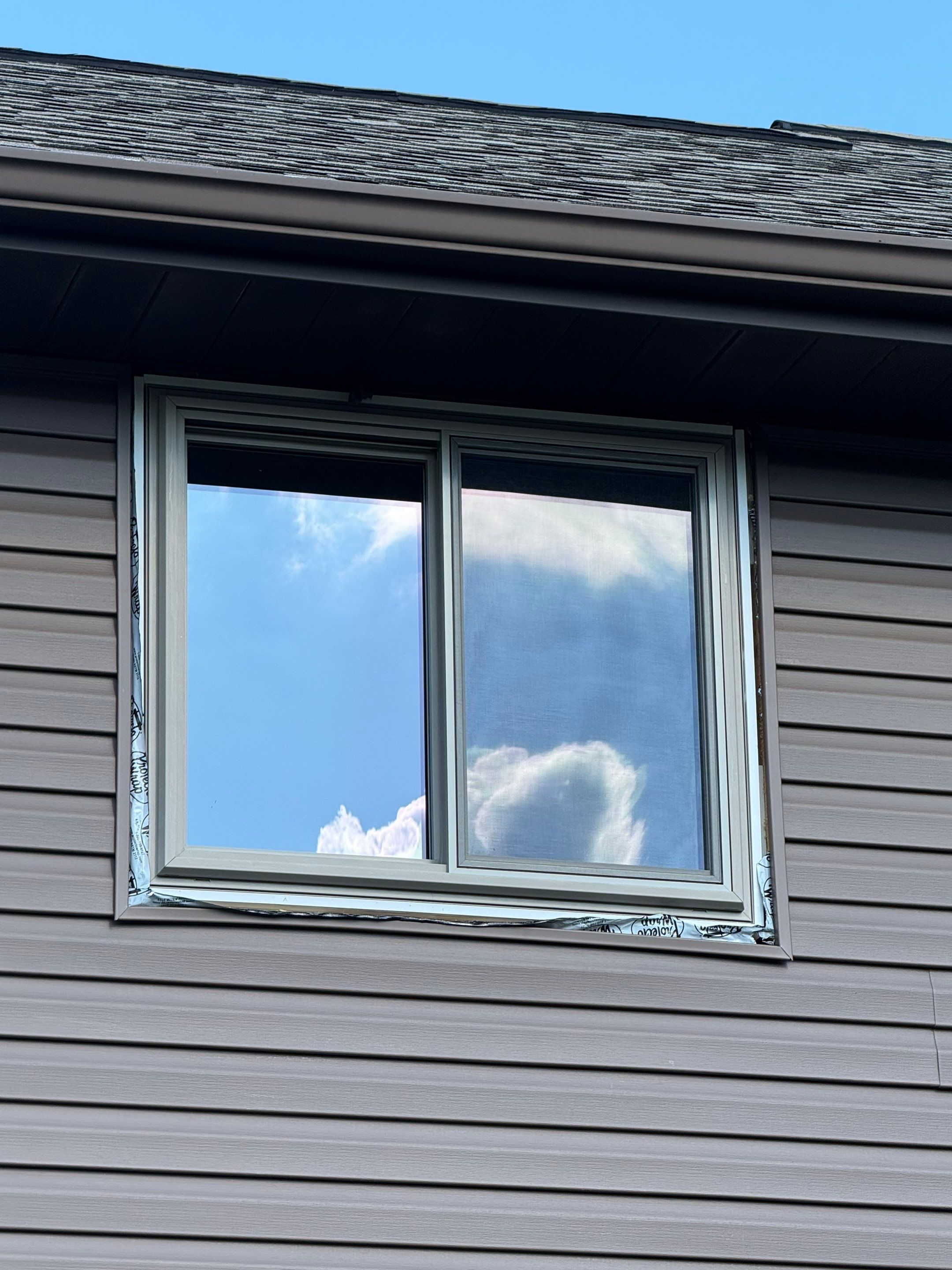 Siding and windows  by Cousins Roofing Siding & Decks