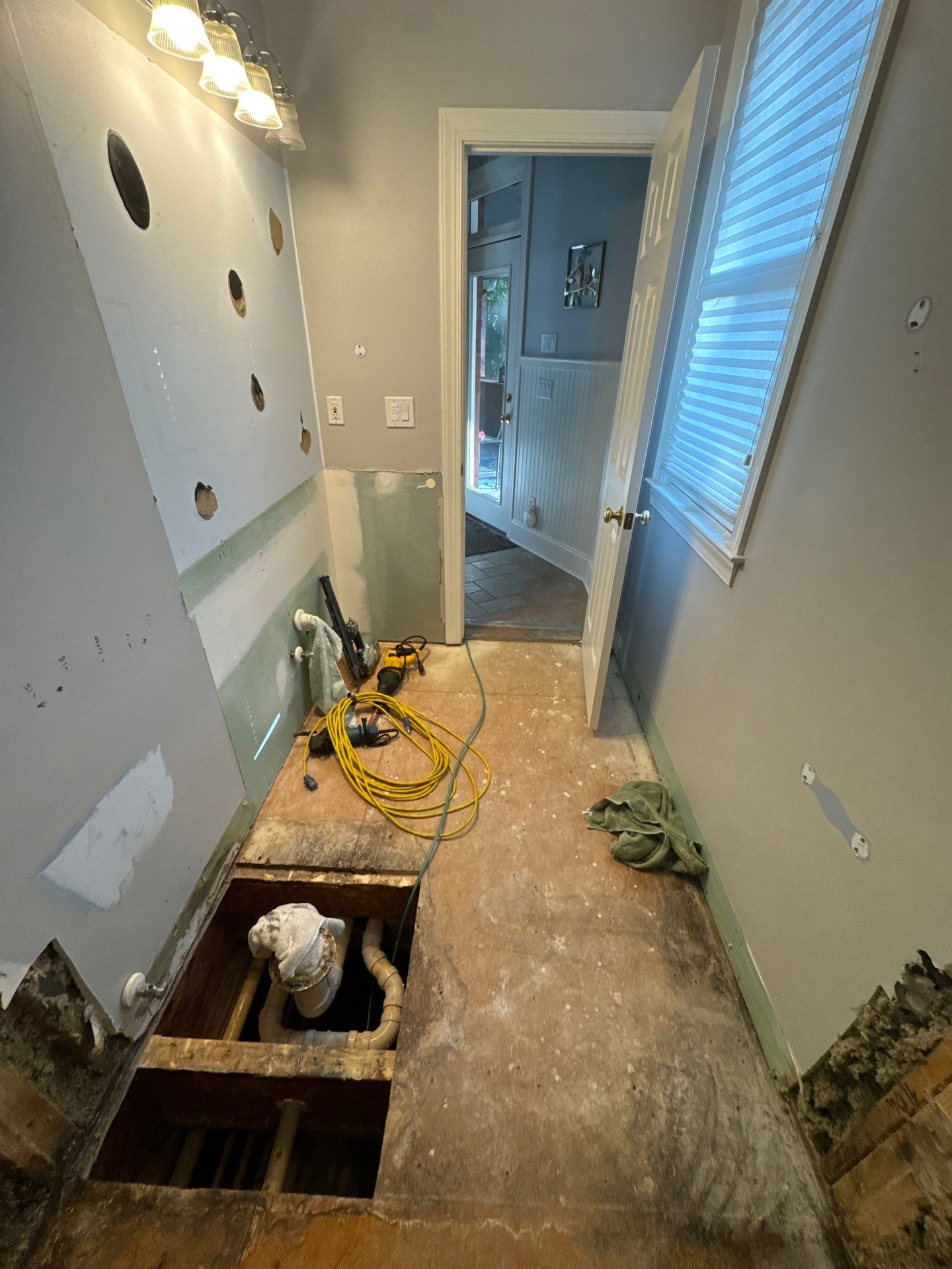 Marietta Bathroom Remodel with Marble Tile and Pebble Floor by Swift Home Renovations