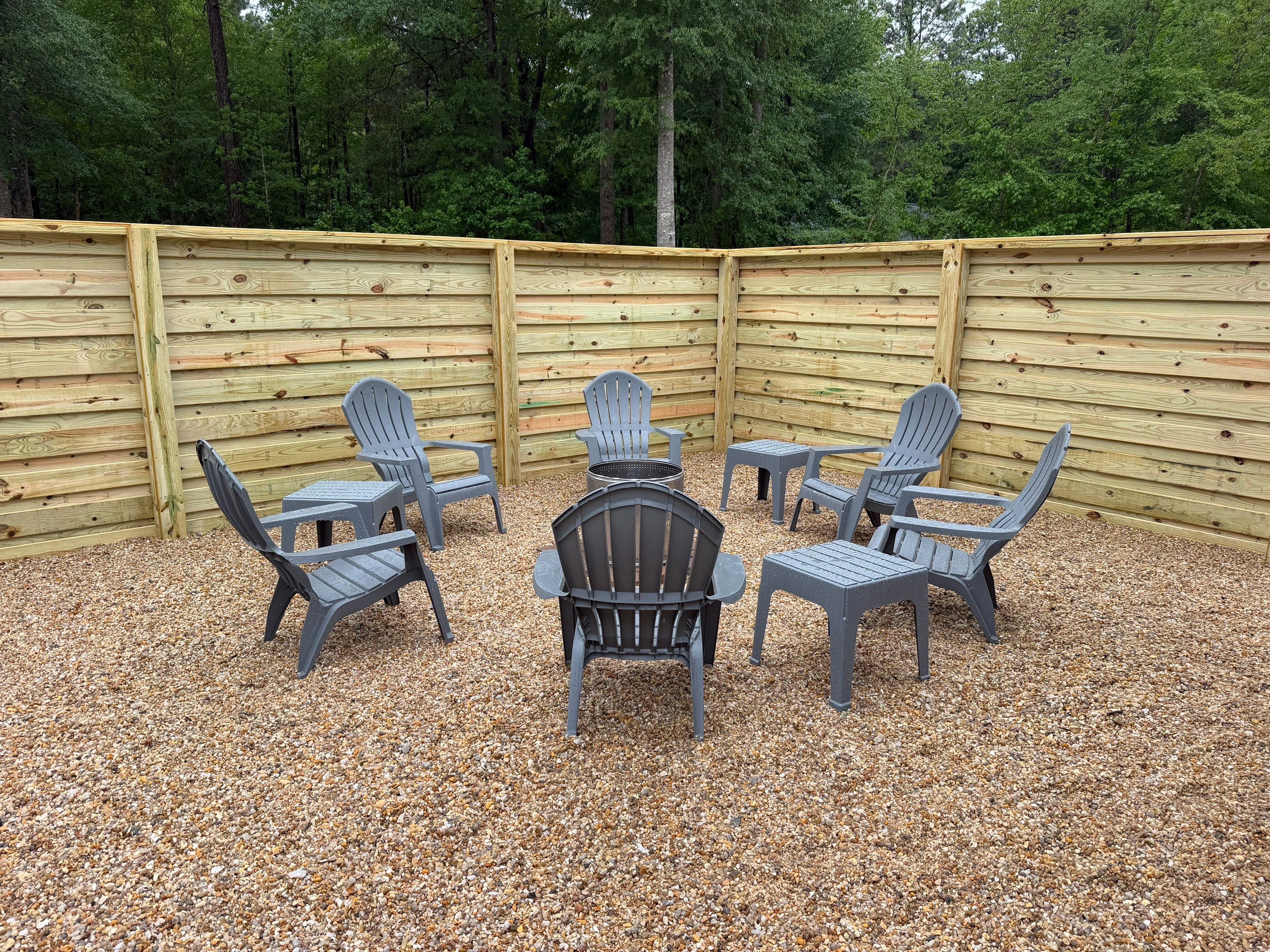 Modern Horizontal Wood Privacy Fence and Backyard Patio in Greenville by Superior Fence and Rail