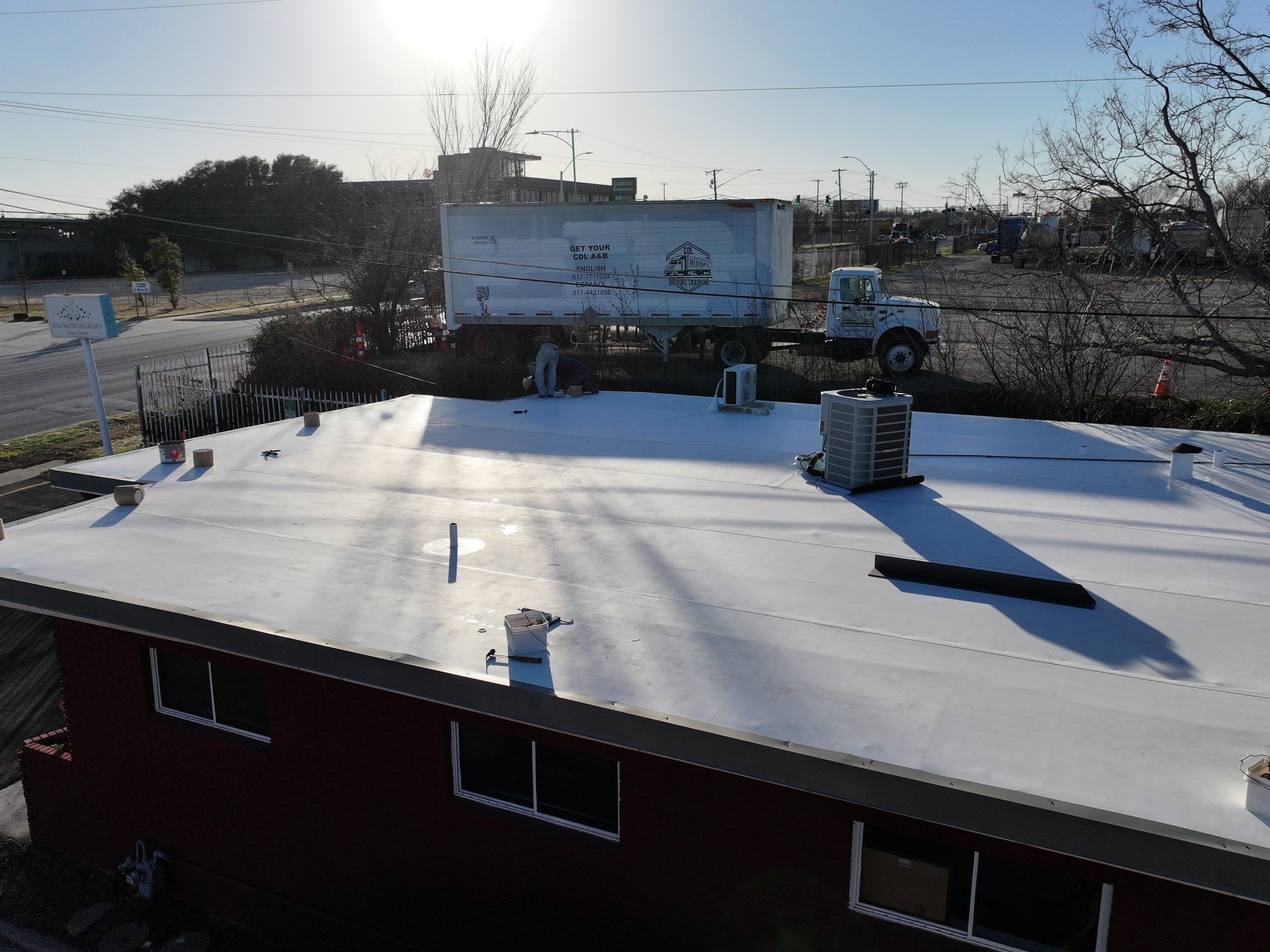 Commercial roofing overlay using GAF TPO over an old ballast roof by Becker Roofing and Exteriors