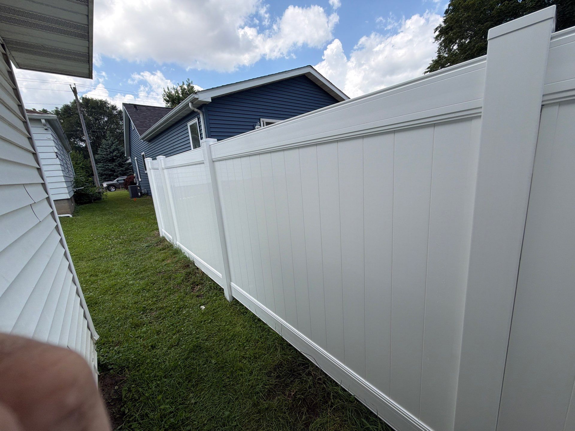 White Vinyl Privacy Fence Installation in Waterloo, Iowa by Perfect Picket Fence and Stain