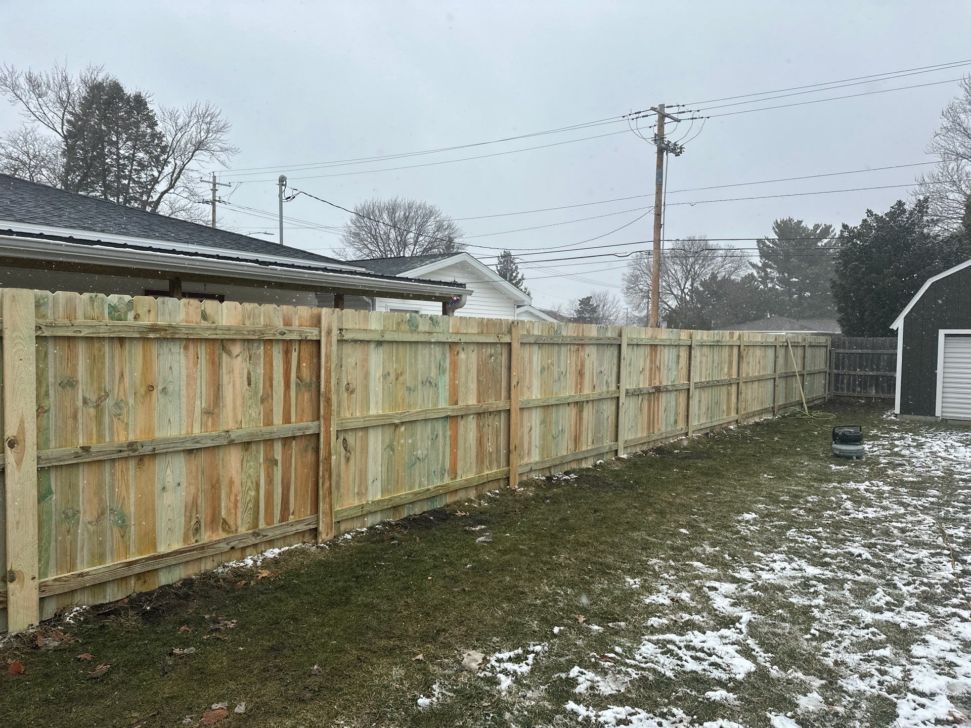 Pressure-Treated Wood Privacy Fence Replacement in Waterloo by Perfect Picket Fence and Stain