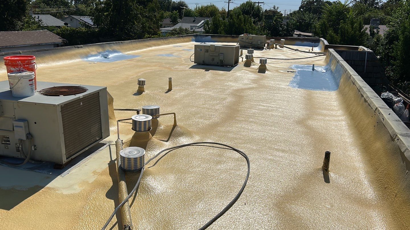 Foam Refurbish using Conklin Benchmark/PUMA XL coatings and spray foam; Also metal roofing around parapet wall by Straight Edge Roofing Inc