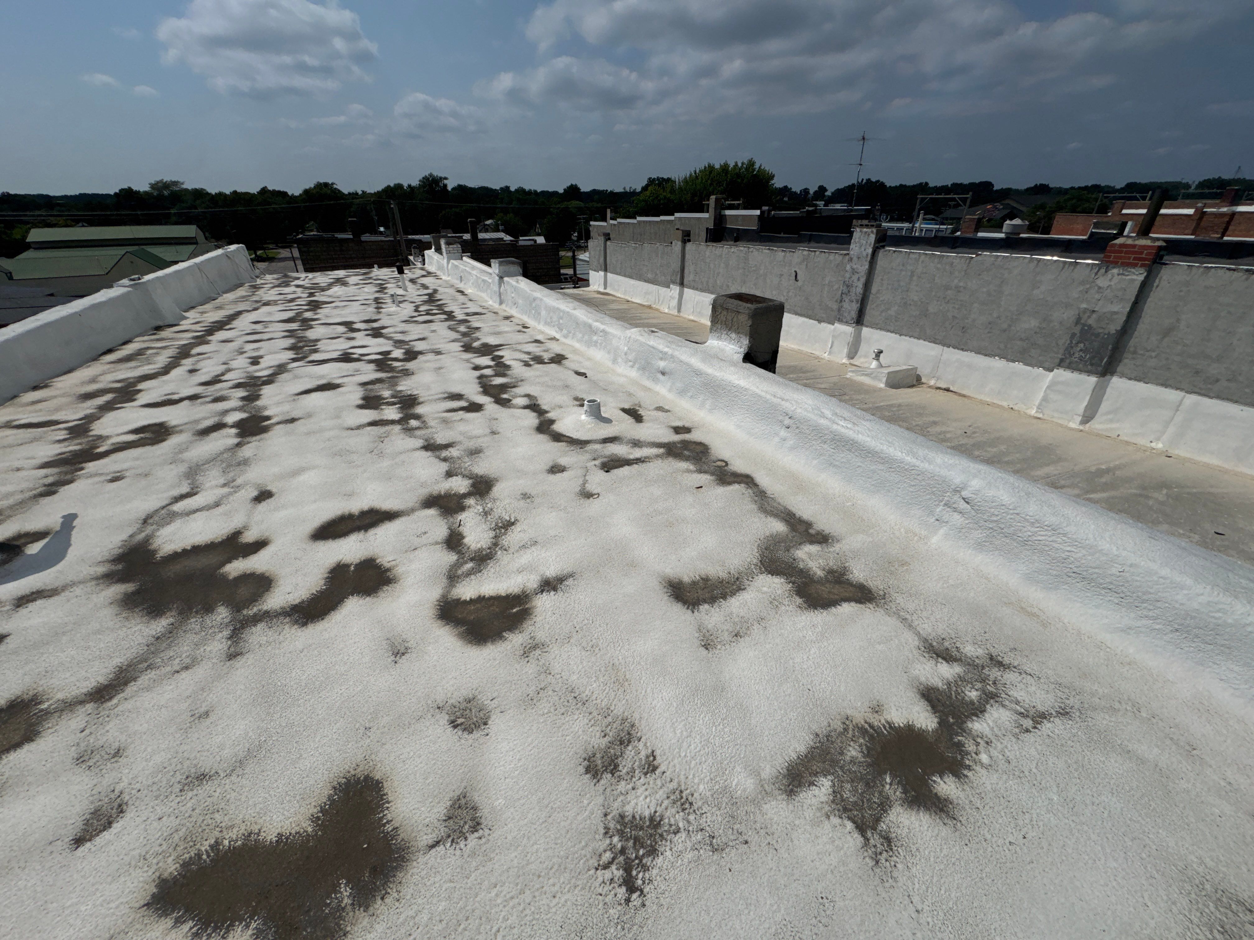Commercial Flat Roof Elastomeric Coating and Repair in West Point by Crows Roofing LLC
