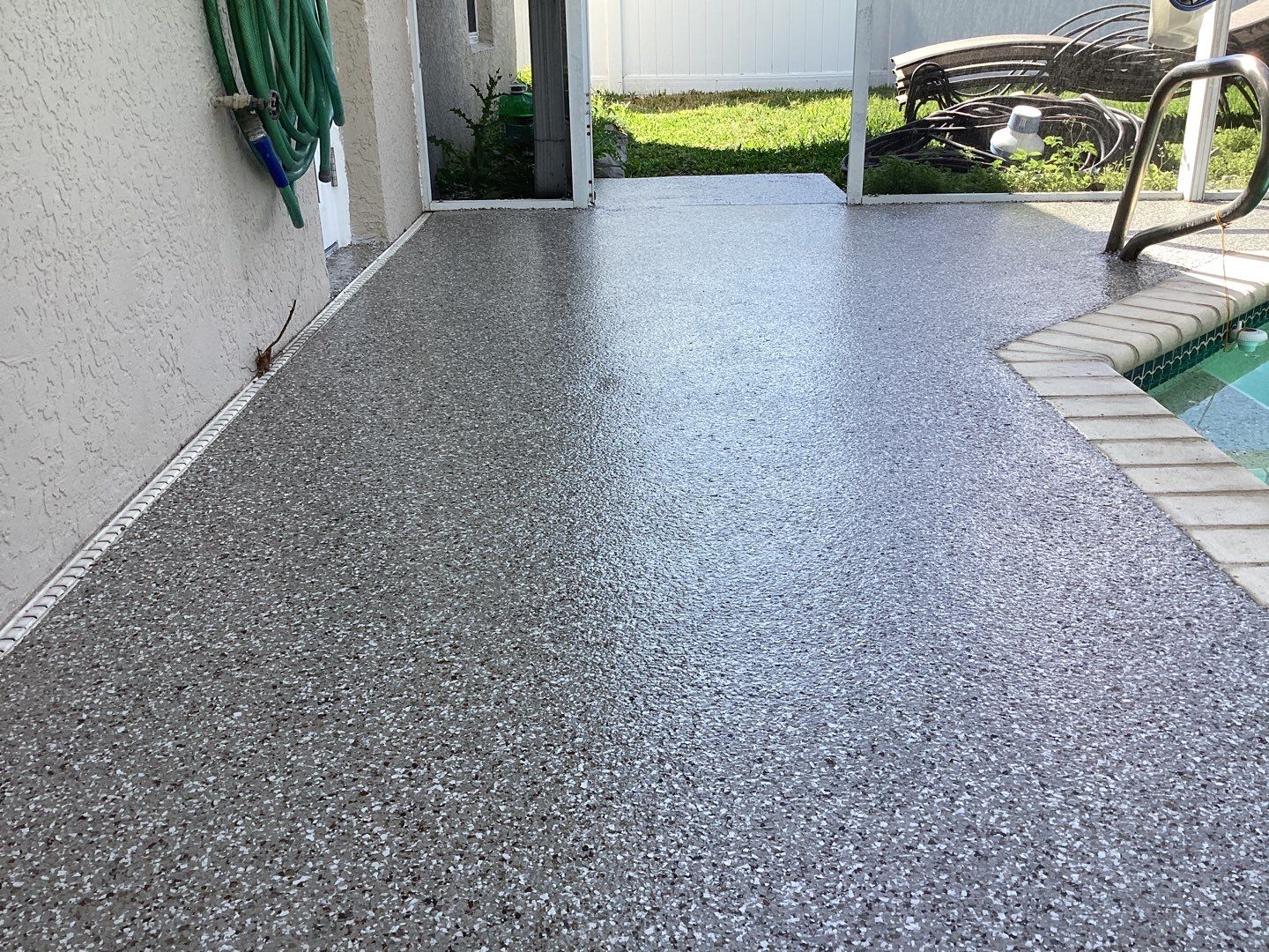 Patio using Pebble Beach by Amvet concrete coatings llc