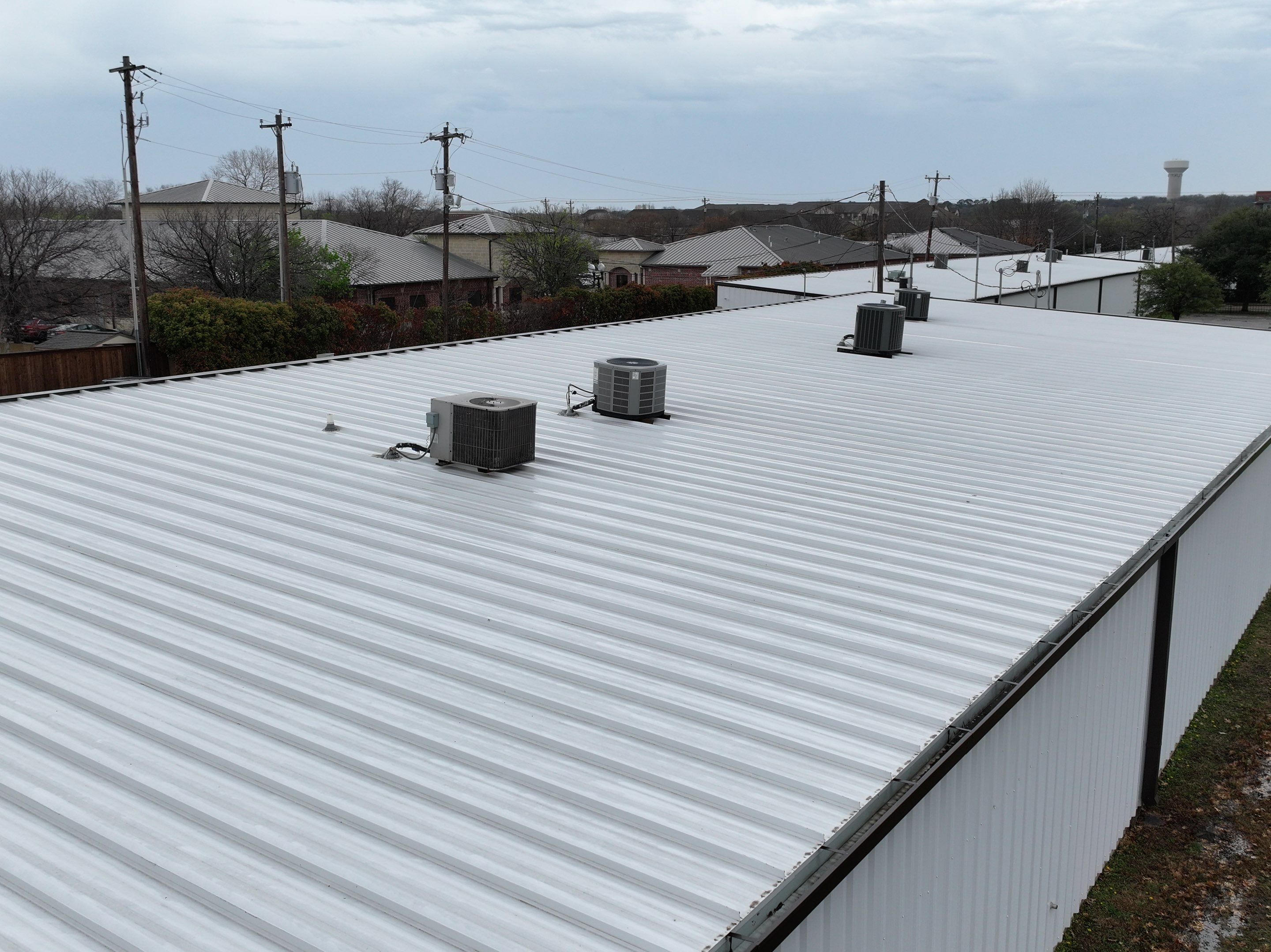 Commercial Roofing Installation using Double lock Mechanical Standing Seam Metal by Becker Roofing and Exteriors