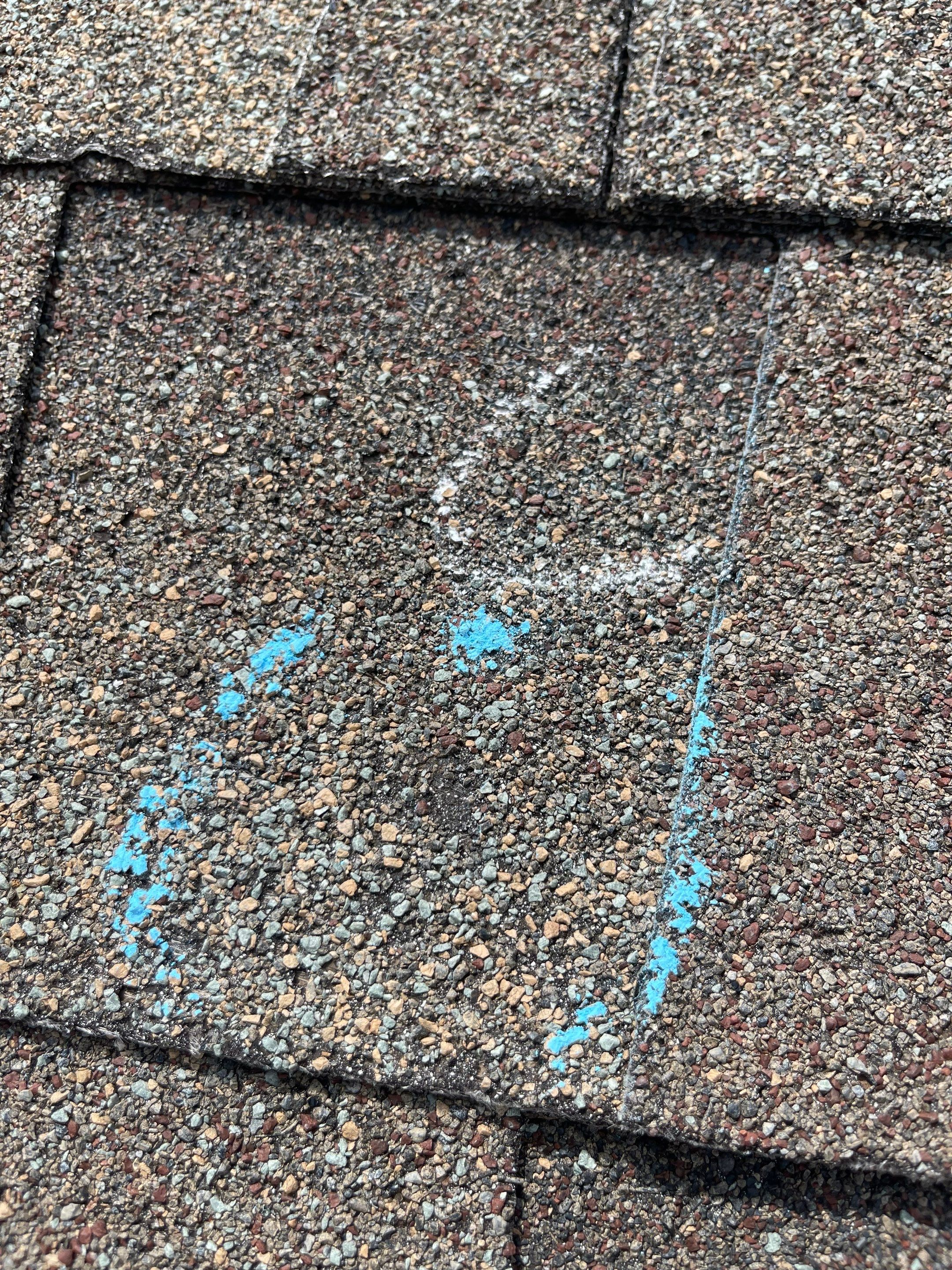 Hail Damage on a Roofing System by Icon Roofing And Construction 