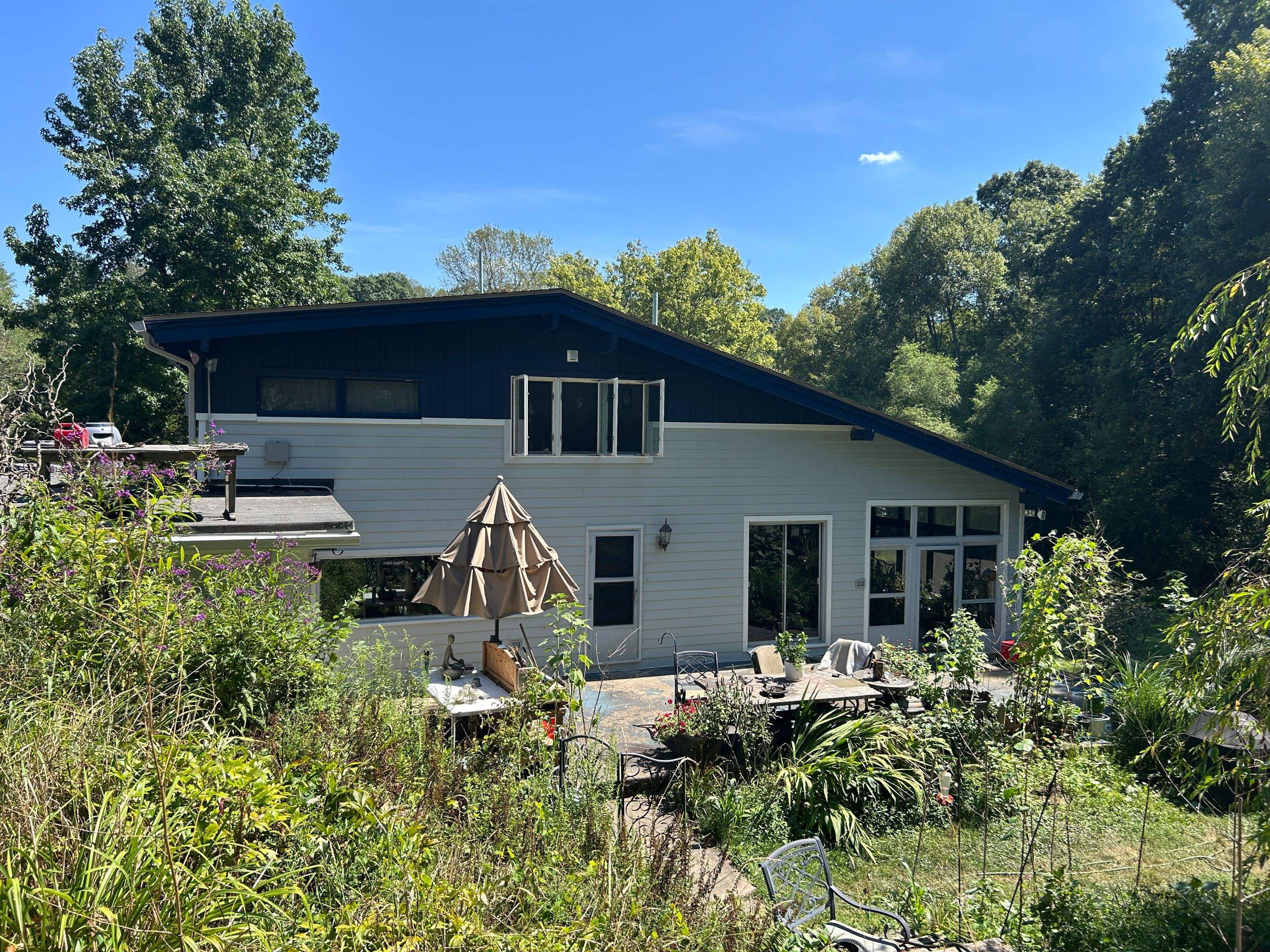 Two-Tone Siding and Sunroom Exterior Remodel in Beaver Falls by Ideal Siding Pittsburgh