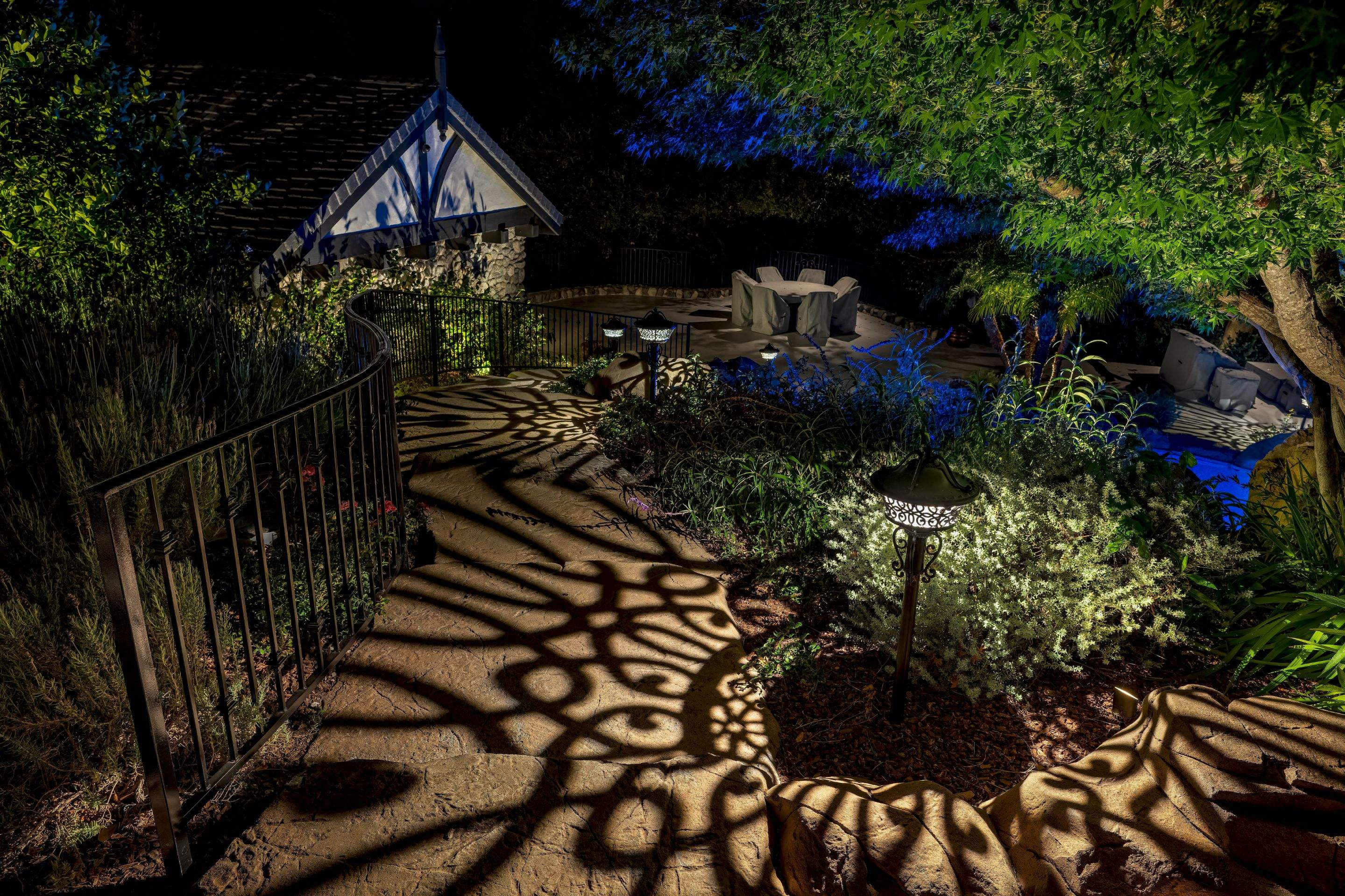 Tudor Estate Landscape Lighting with Integrated Stone Step Illumination by Outdoor Lights + Shades