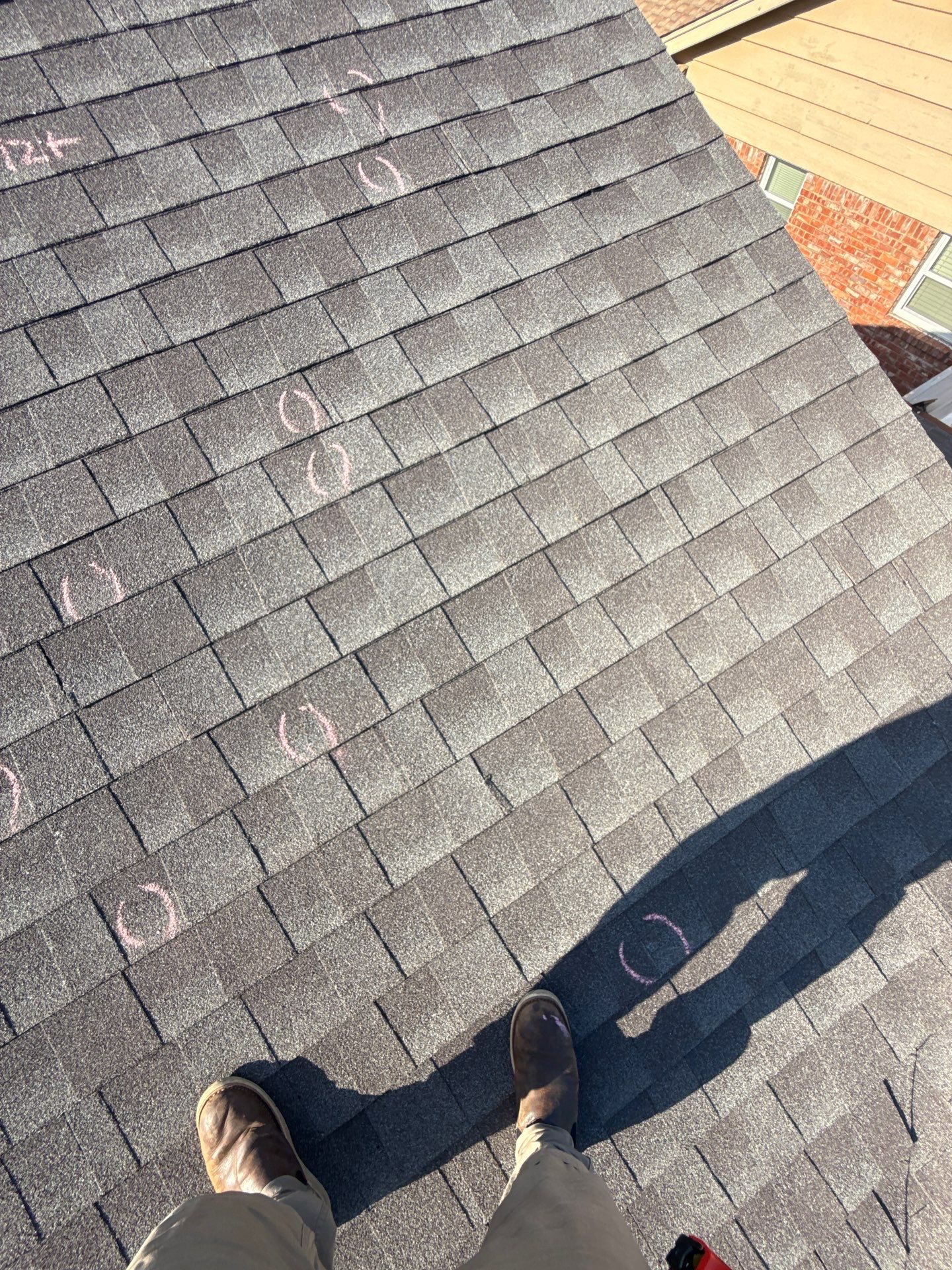 Hail Damage Roof Inspection in Oklahoma City, OK by McCann's Roofing and Construction