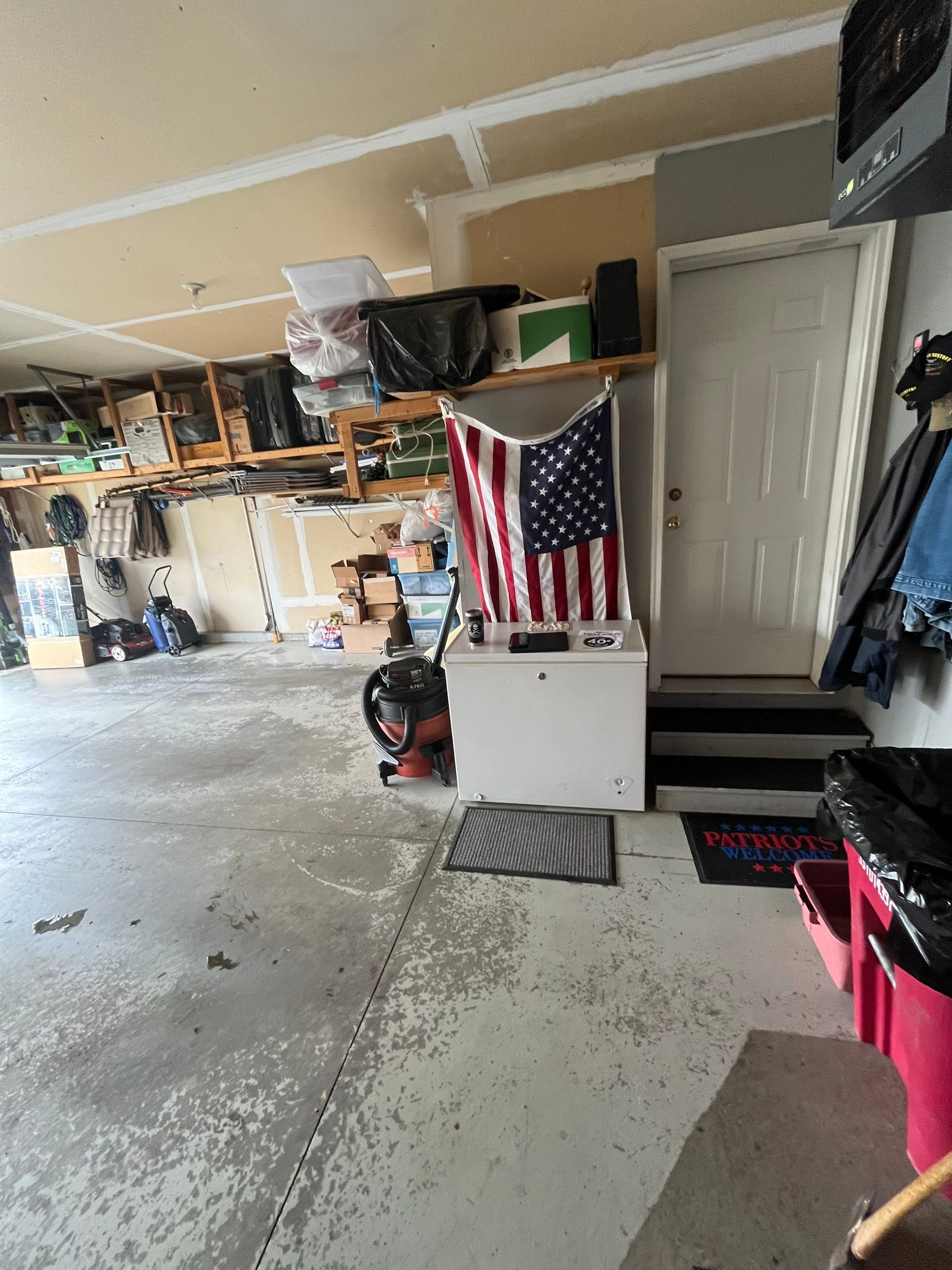 Nightfall Grey Speckled Epoxy Garage Floor Coating in Sioux Falls by Select Painting, Coatings & Garage Cabinets