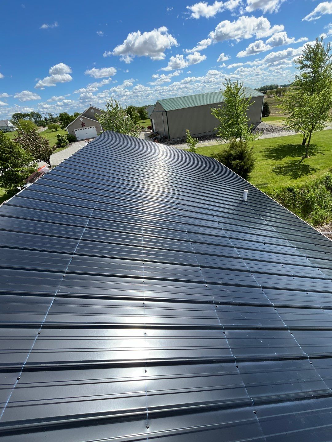 Residential Roofing Installation using Perfromance Panel Metal - Black by RoofX 