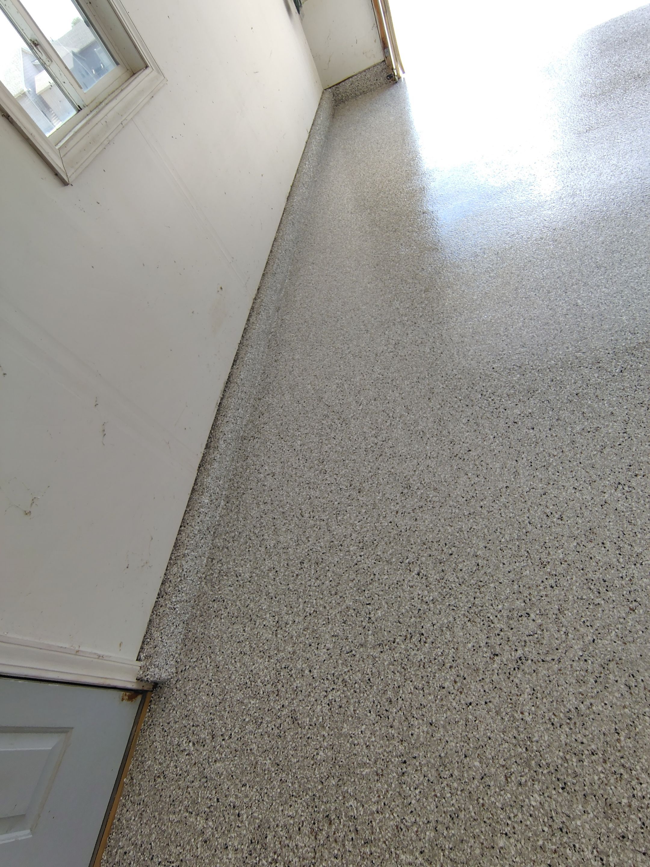 Decorative Chip Epoxy Garage Floor Coating in Sioux Falls by Select Painting, Coatings & Garage Cabinets