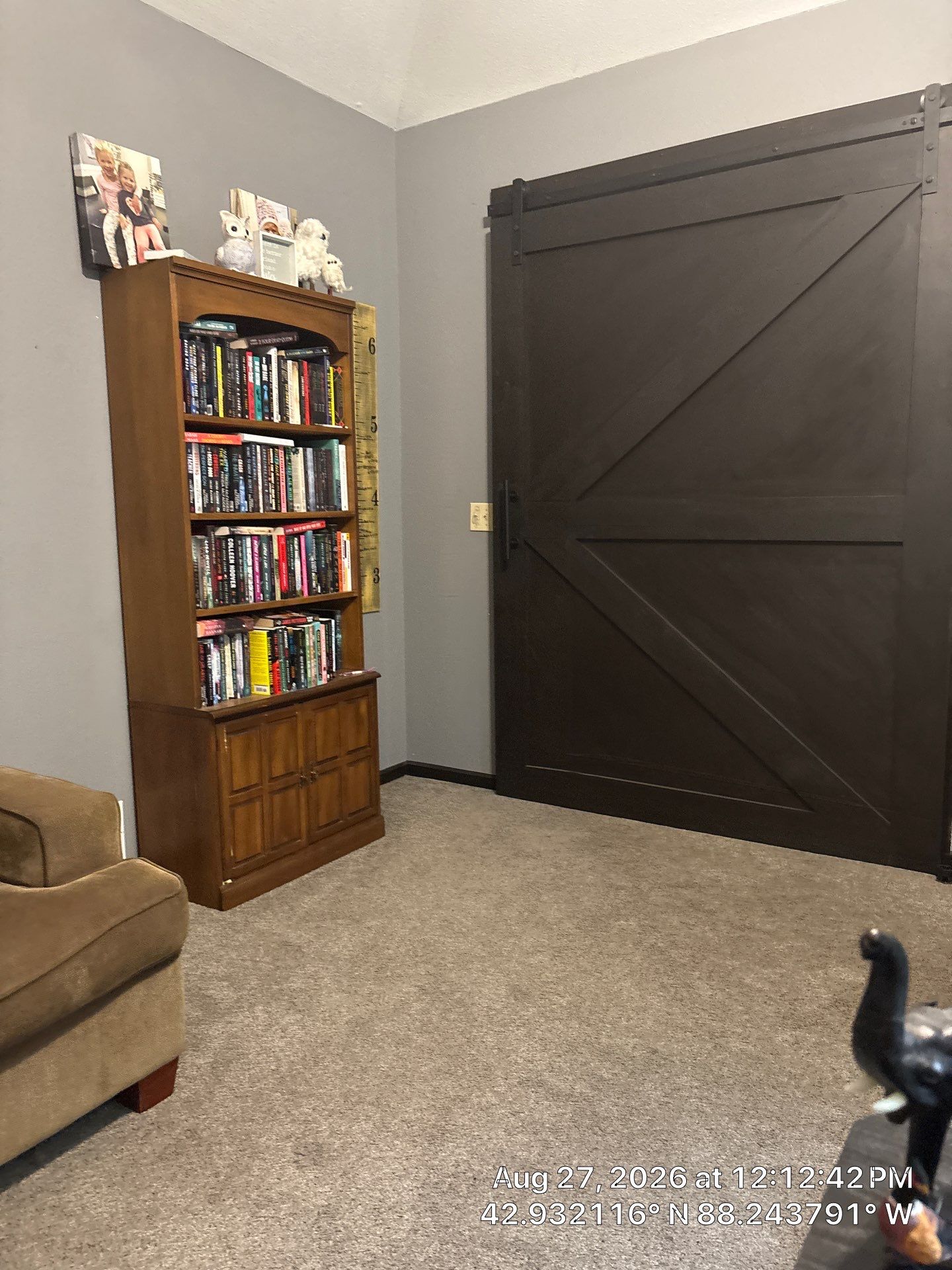 Dark-Stained Wood Sliding Barn Door Installation in Waukesha by CompanyCam Sales Demo