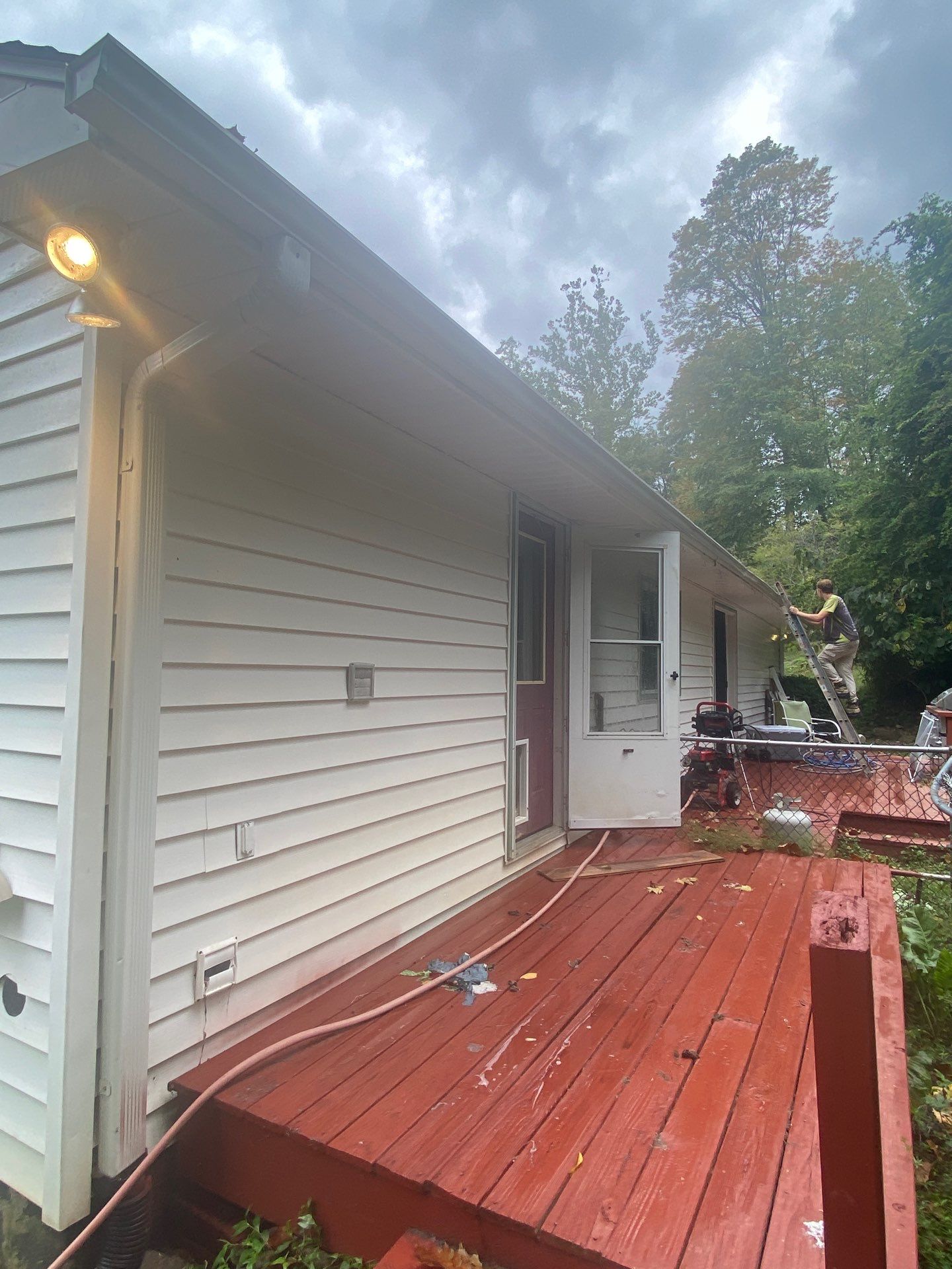 the service being done is house washing with focus on the deck and siding removing dirt and debris from surfaces