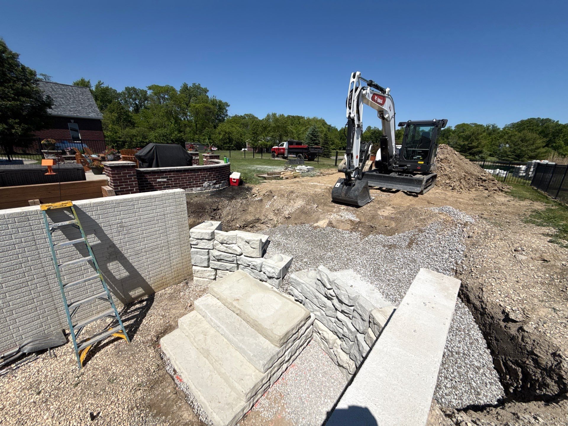 Basement Walkout Construction with Tiered Retaining Walls in Berkey by Farrell's Lawn & Garden Center LLC