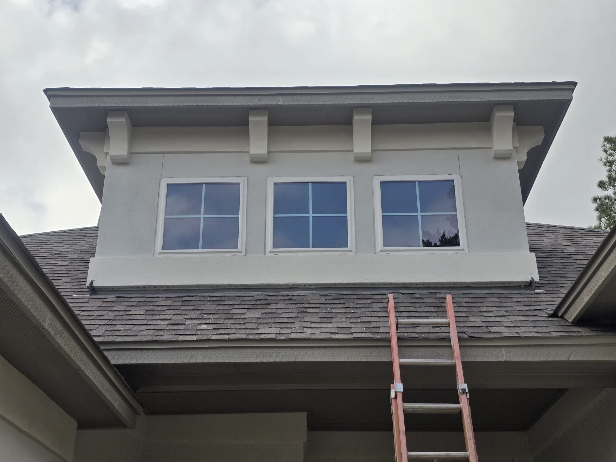 Conroe Elegance: Stucco, Foam Corbels, and Natural Stone Accents. by Apex Conventional Stucco Llc