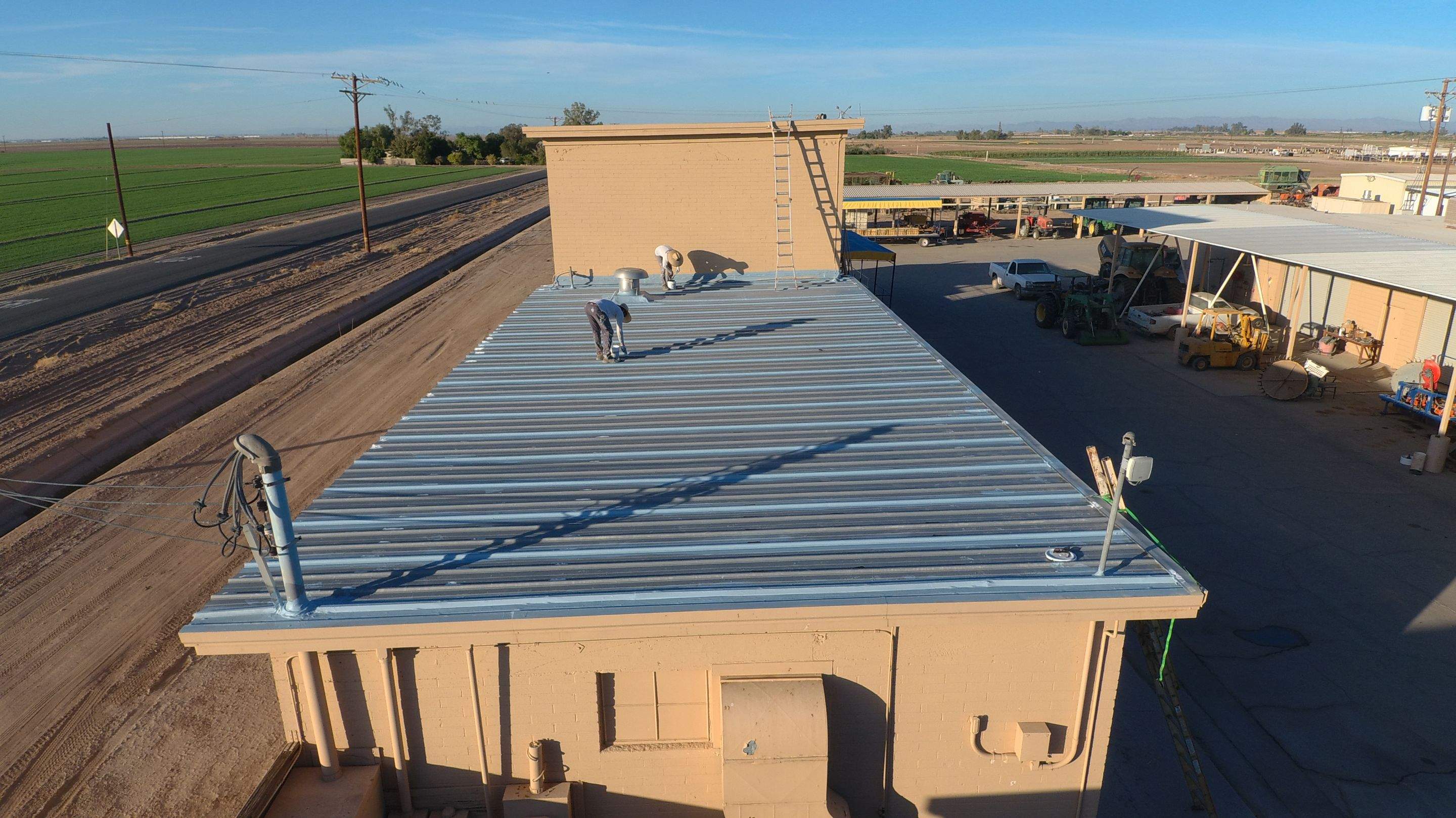 Metal roof restoration on commercial roof using Conklin Benchmark/PUMA XL fabric and coating by Straight Edge Roofing Inc