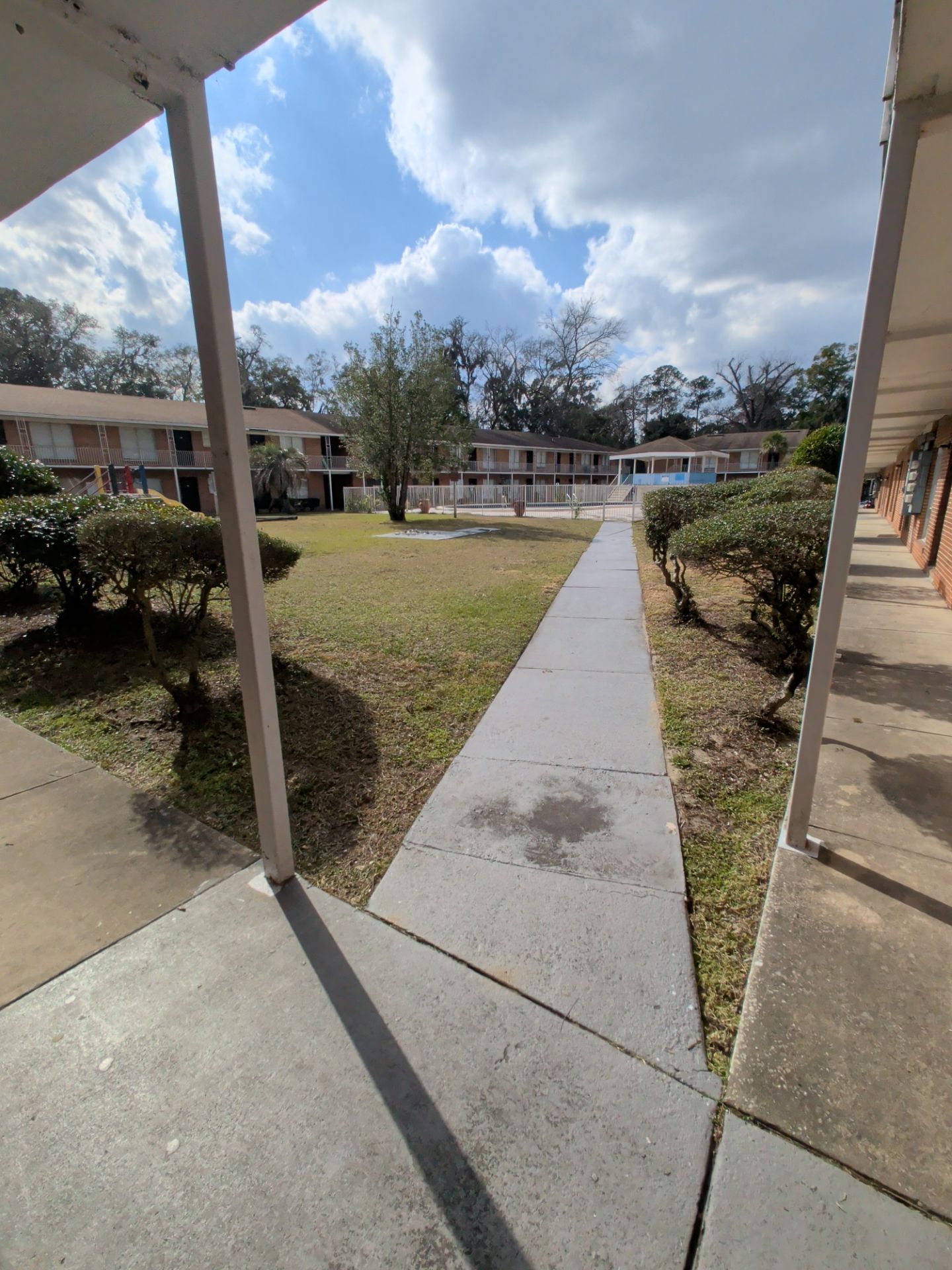 Apartment Landscape Cleanup & Ongoing Grounds Maintenance — Cimarron Apartments (Arlington) by Harmoni Home Services