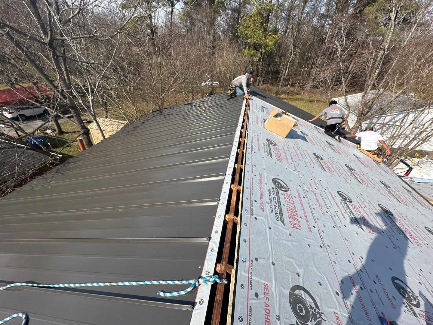 Residential Roofing Installation using Standing Seam Metal by Undersun Roofing 
