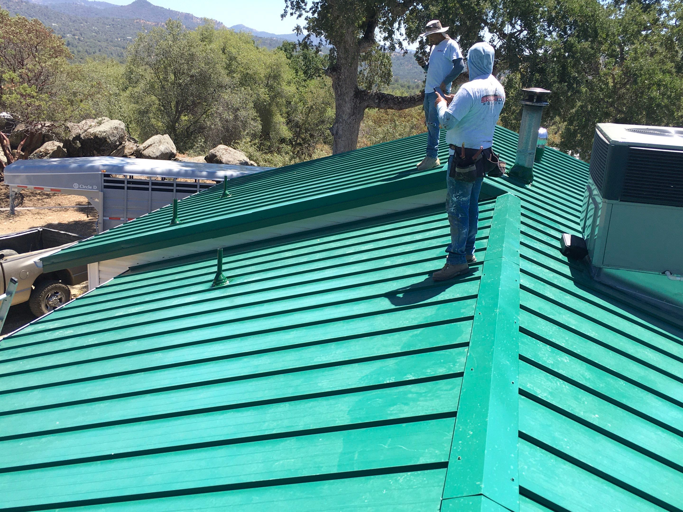 Metal roofing installation using Standing seam metal roofing system by Straight Edge Roofing Inc