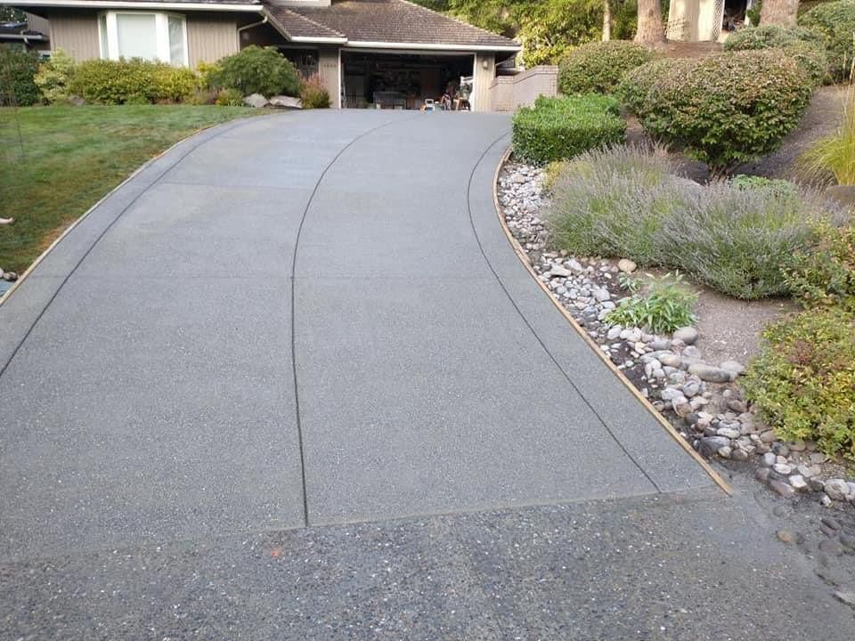 Cristi | Sand Finish Concrete Driveway  by Jireh Asphalt & Concrete Inc 