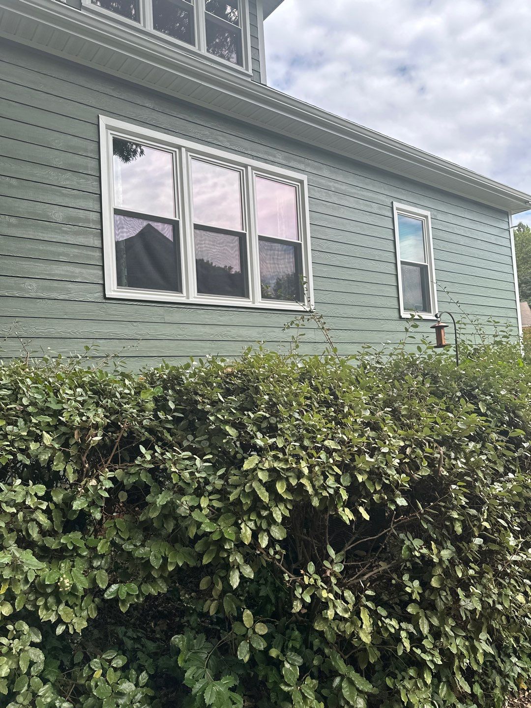 Raleigh Siding and Window Replacement with Custom Green Finish by The Remodeling Company