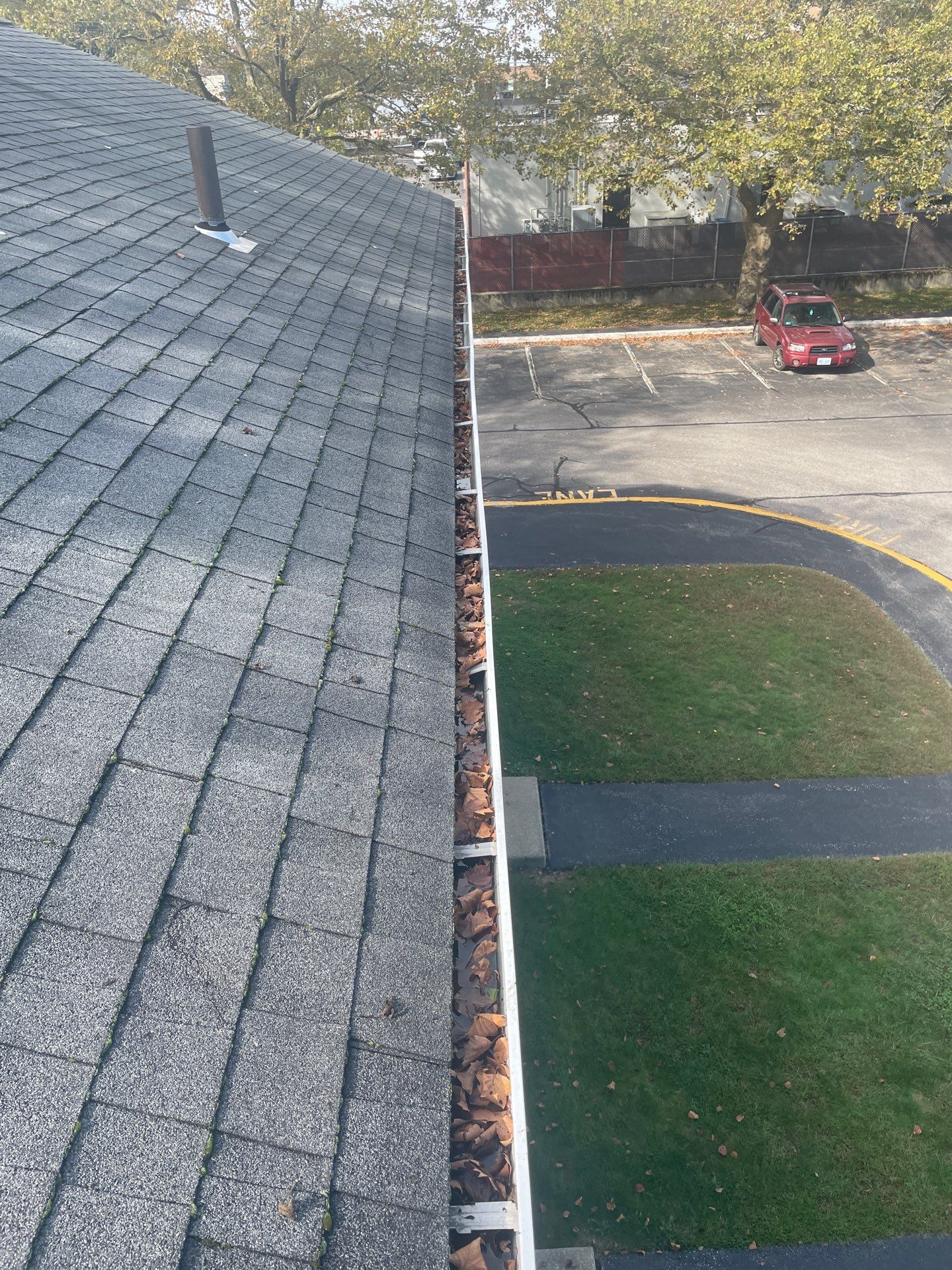 Commercial gutter cleaning Rhode Island before photo with filled gutters